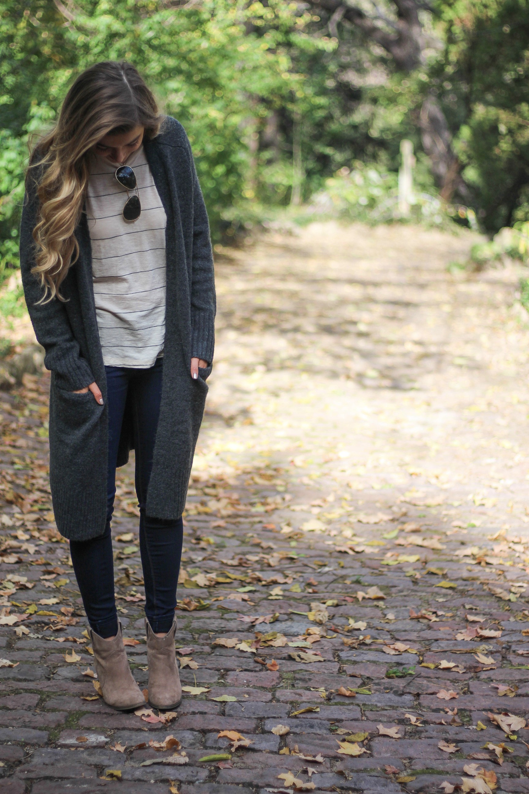 Long cardigan with striped shirt cute and simple outfit for fall! Perfectly paired with booties. The perfect fall or winter outfit by Lauren Lindmark on Daily Dose of Charm dailydoseofcharm.com