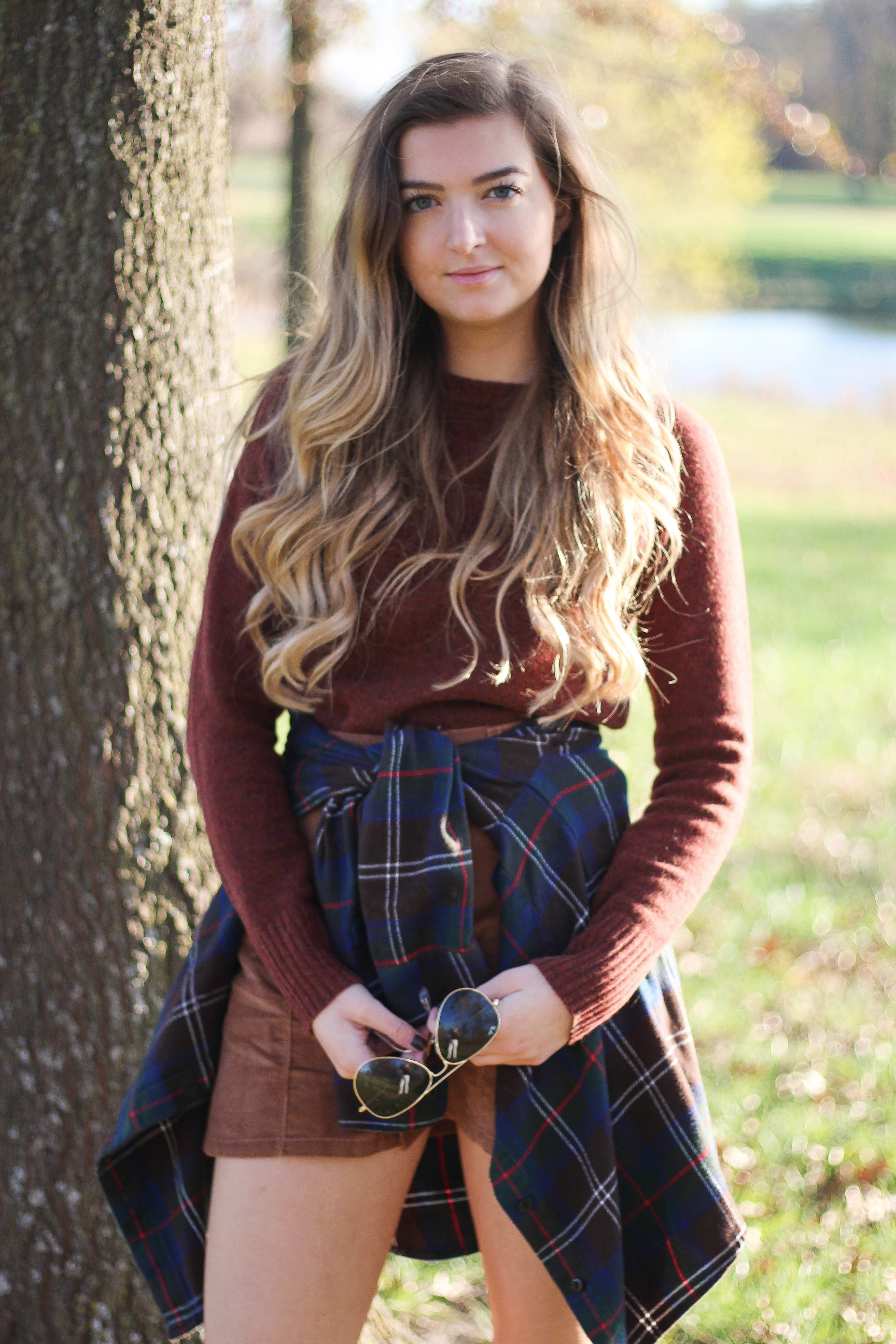 The perfect fall outfit! The corduroy skirt is showing up everywhere so I decided to pair it with a flannel to be a bit different. Of course I added a burgundy sweater because it's my favorite color for fall! As for my boyfriend, he's rocking a JORD wooden watch that I am in love with! Cute couple pictures are my favorite, check out our poses for engagement photo ideas and more! By Lauren Lindmark on Daily Dose of Charm dailydoseofcharm.com