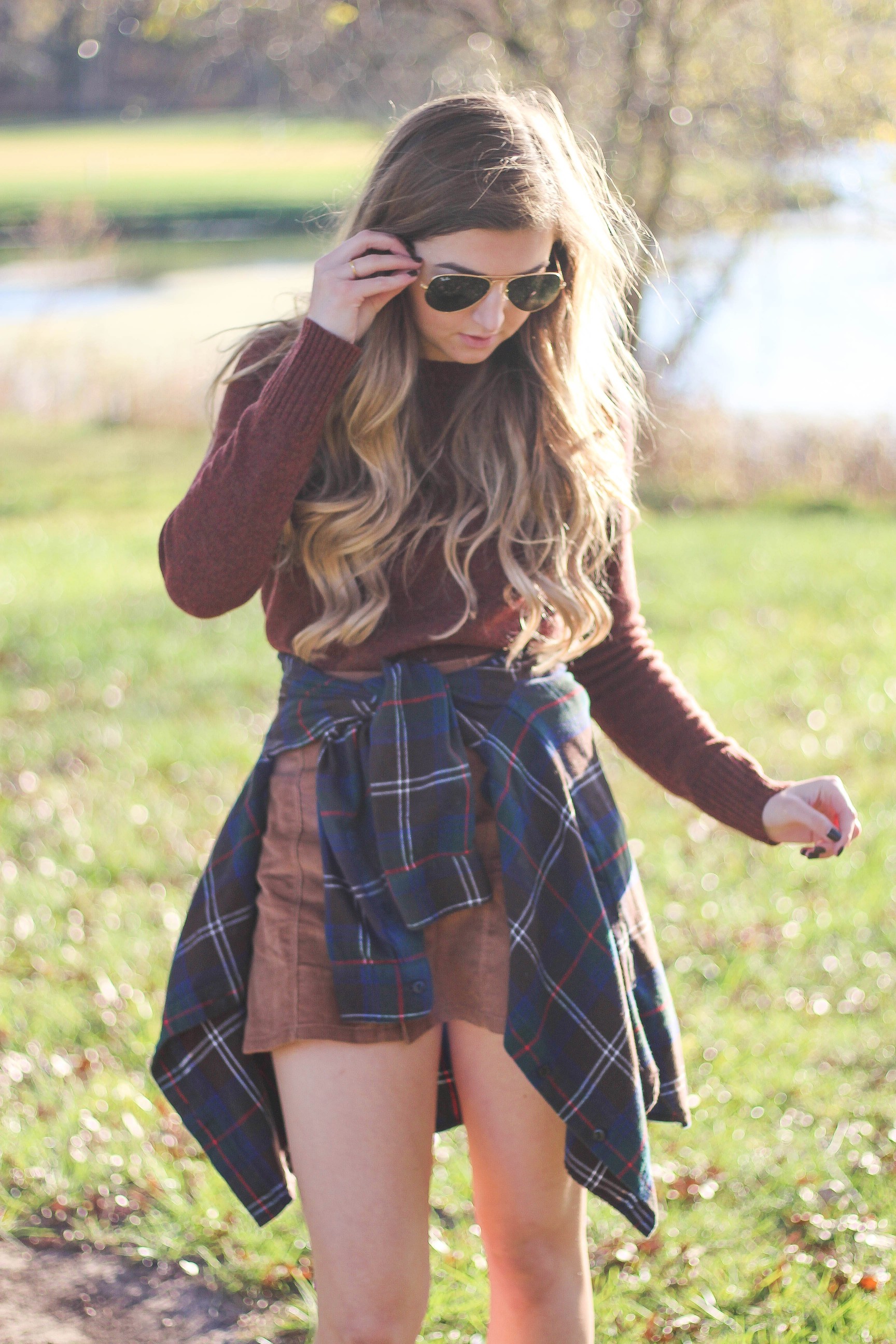 The perfect fall outfit! The corduroy skirt is showing up everywhere so I decided to pair it with a flannel to be a bit different. Of course I added a burgundy sweater because it's my favorite color for fall! As for my boyfriend, he's rocking a JORD wooden watch that I am in love with! Cute couple pictures are my favorite, check out our poses for engagement photo ideas and more! By Lauren Lindmark on Daily Dose of Charm dailydoseofcharm.com