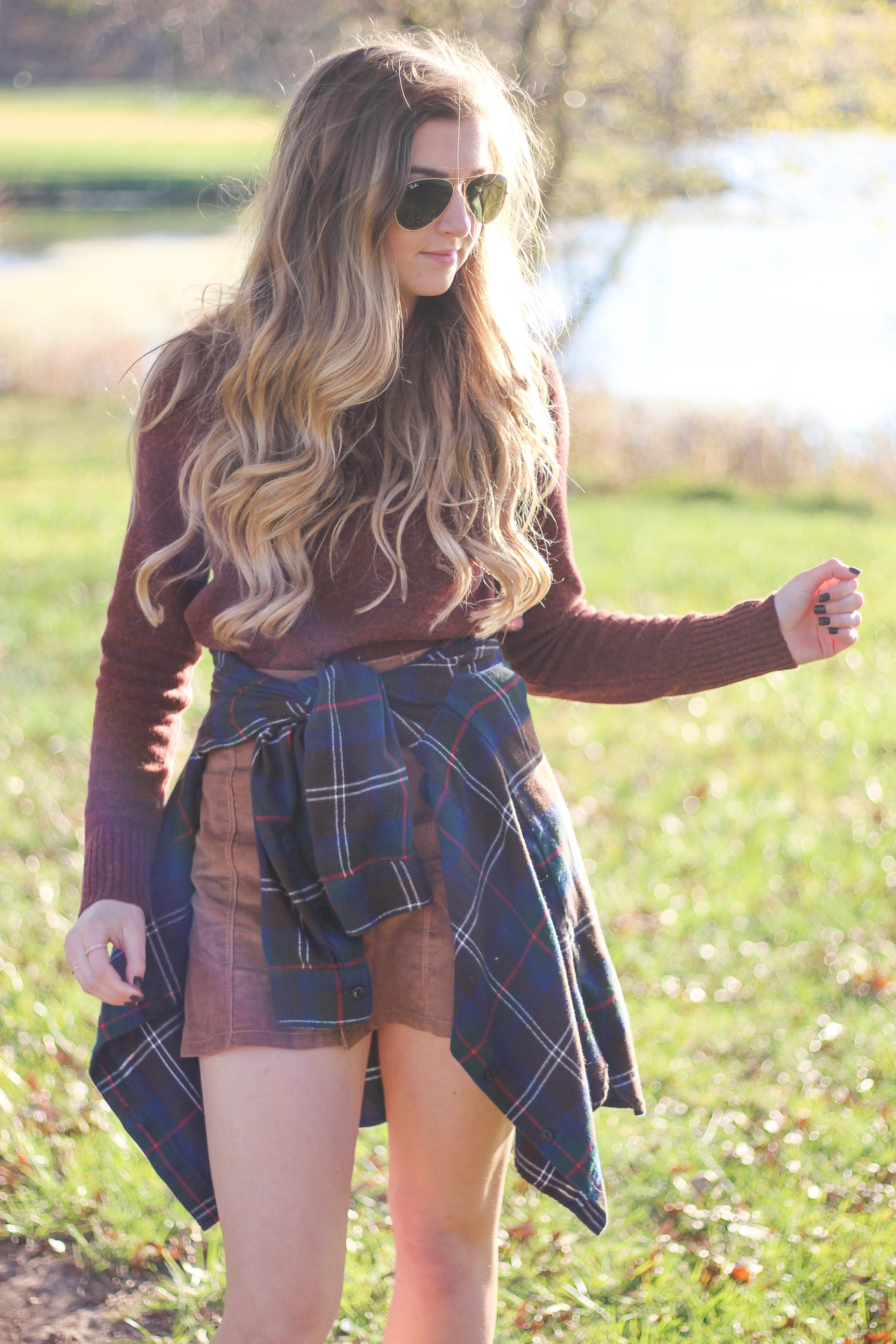 The perfect fall outfit! The corduroy skirt is showing up everywhere so I decided to pair it with a flannel to be a bit different. Of course I added a burgundy sweater because it's my favorite color for fall! As for my boyfriend, he's rocking a JORD wooden watch that I am in love with! Cute couple pictures are my favorite, check out our poses for engagement photo ideas and more! By Lauren Lindmark on Daily Dose of Charm dailydoseofcharm.com