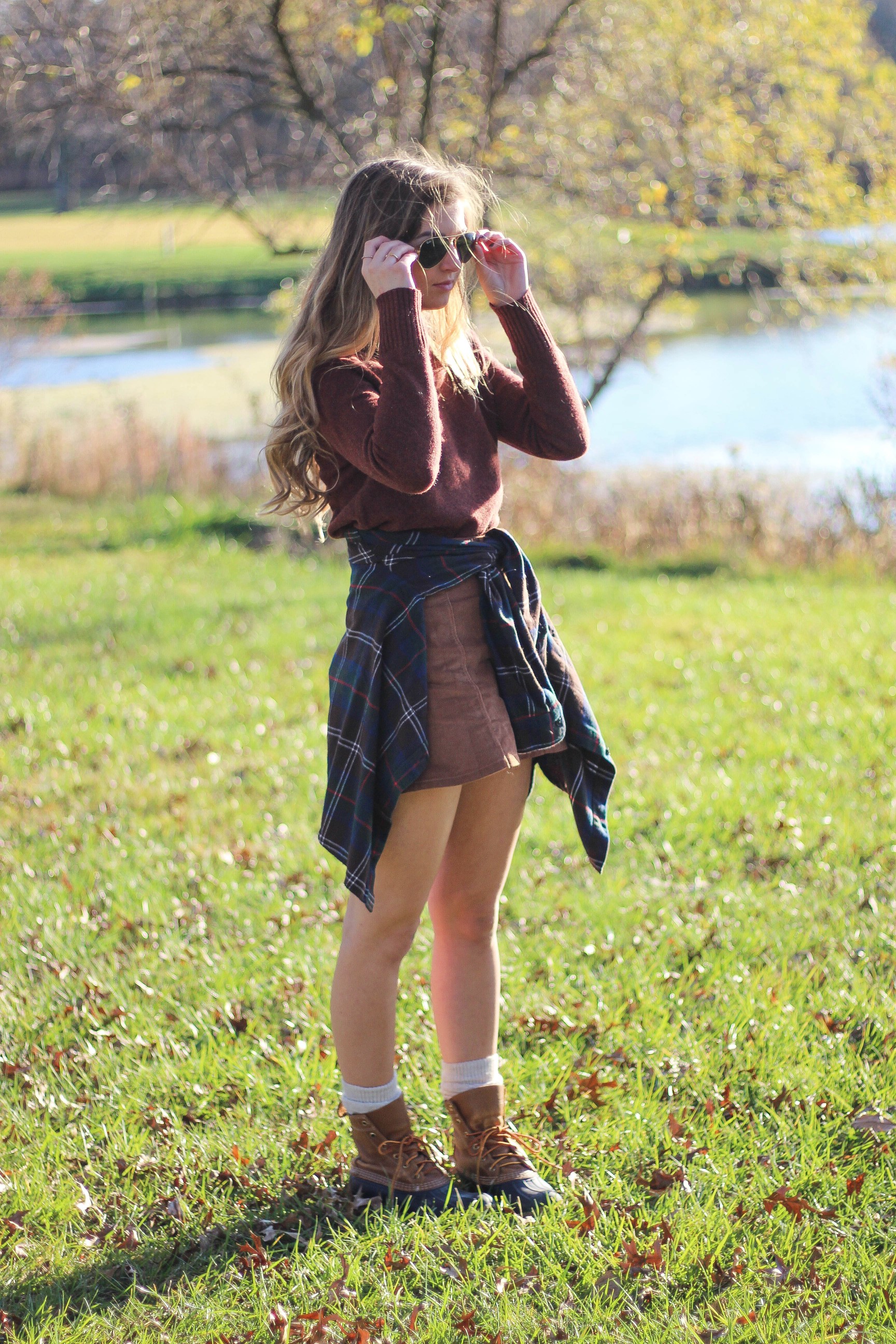 The perfect fall outfit! The corduroy skirt is showing up everywhere so I decided to pair it with a flannel to be a bit different. Of course I added a burgundy sweater because it's my favorite color for fall! As for my boyfriend, he's rocking a JORD wooden watch that I am in love with! Cute couple pictures are my favorite, check out our poses for engagement photo ideas and more! By Lauren Lindmark on Daily Dose of Charm dailydoseofcharm.com