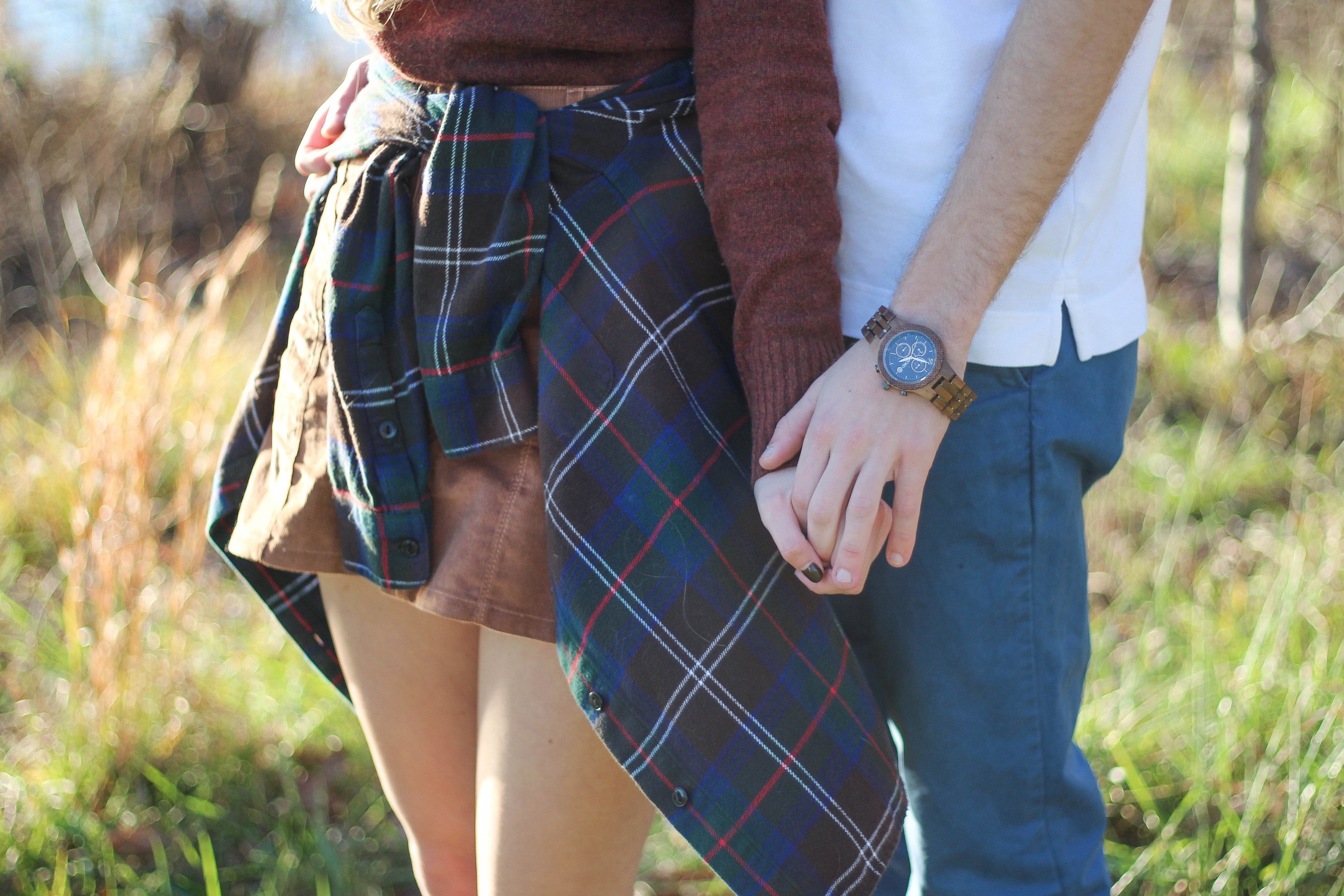 The perfect fall outfit! The corduroy skirt is showing up everywhere so I decided to pair it with a flannel to be a bit different. Of course I added a burgundy sweater because it's my favorite color for fall! As for my boyfriend, he's rocking a JORD wooden watch that I am in love with! Cute couple pictures are my favorite, check out our poses for engagement photo ideas and more! By Lauren Lindmark on Daily Dose of Charm dailydoseofcharm.com