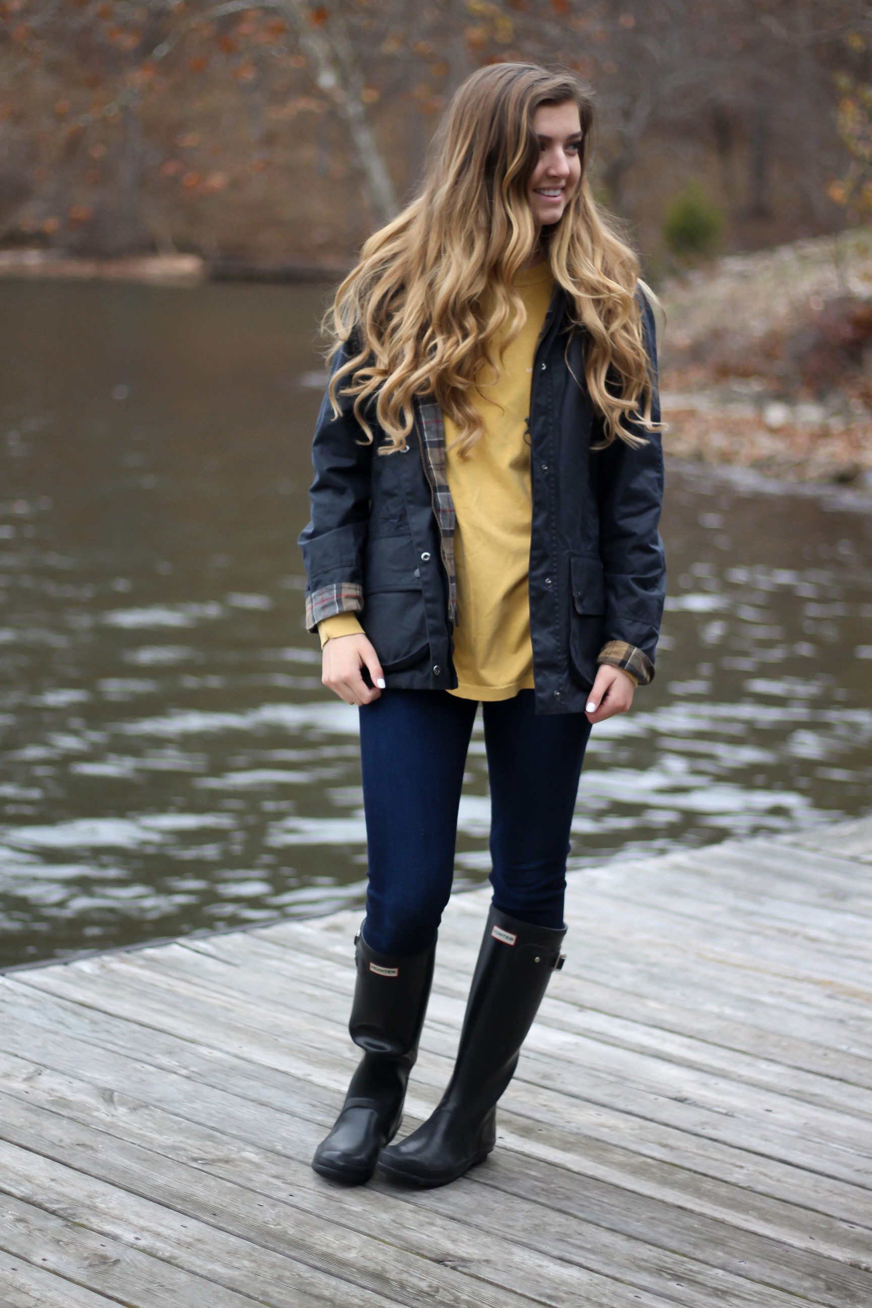 Perfect fall outfit including a Barbour coat, United tee fall t-shirt, and black hunter boots. If you want to know how to style hunter boots this is it! Check it out on my fashion blog daily dose of charm by Lauren Lindmark dailydoseofcharm.com