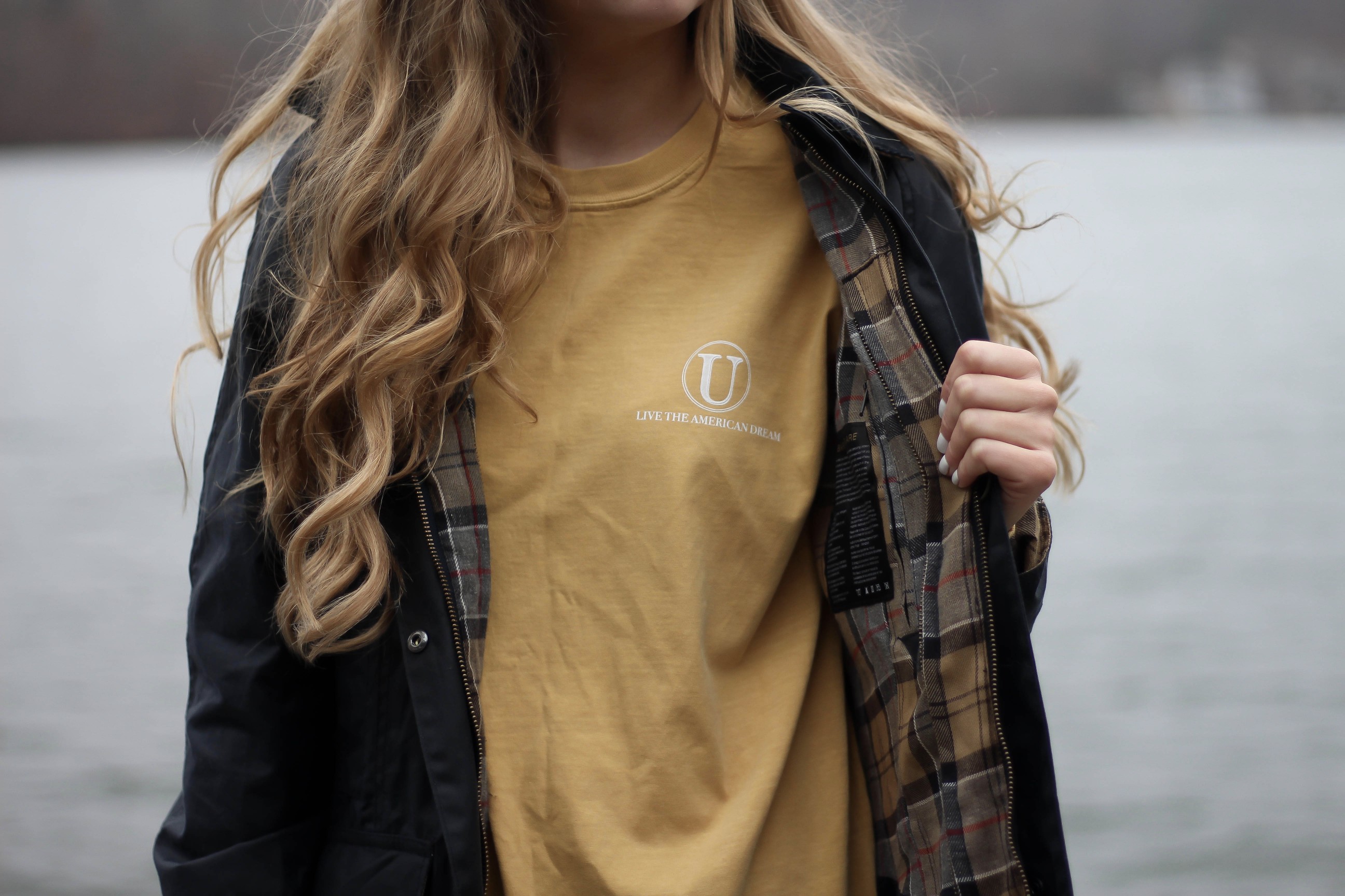 Perfect fall outfit including a Barbour coat, United tee fall t-shirt, and black hunter boots. If you want to know how to style hunter boots this is it! Check it out on my fashion blog daily dose of charm by Lauren Lindmark dailydoseofcharm.com