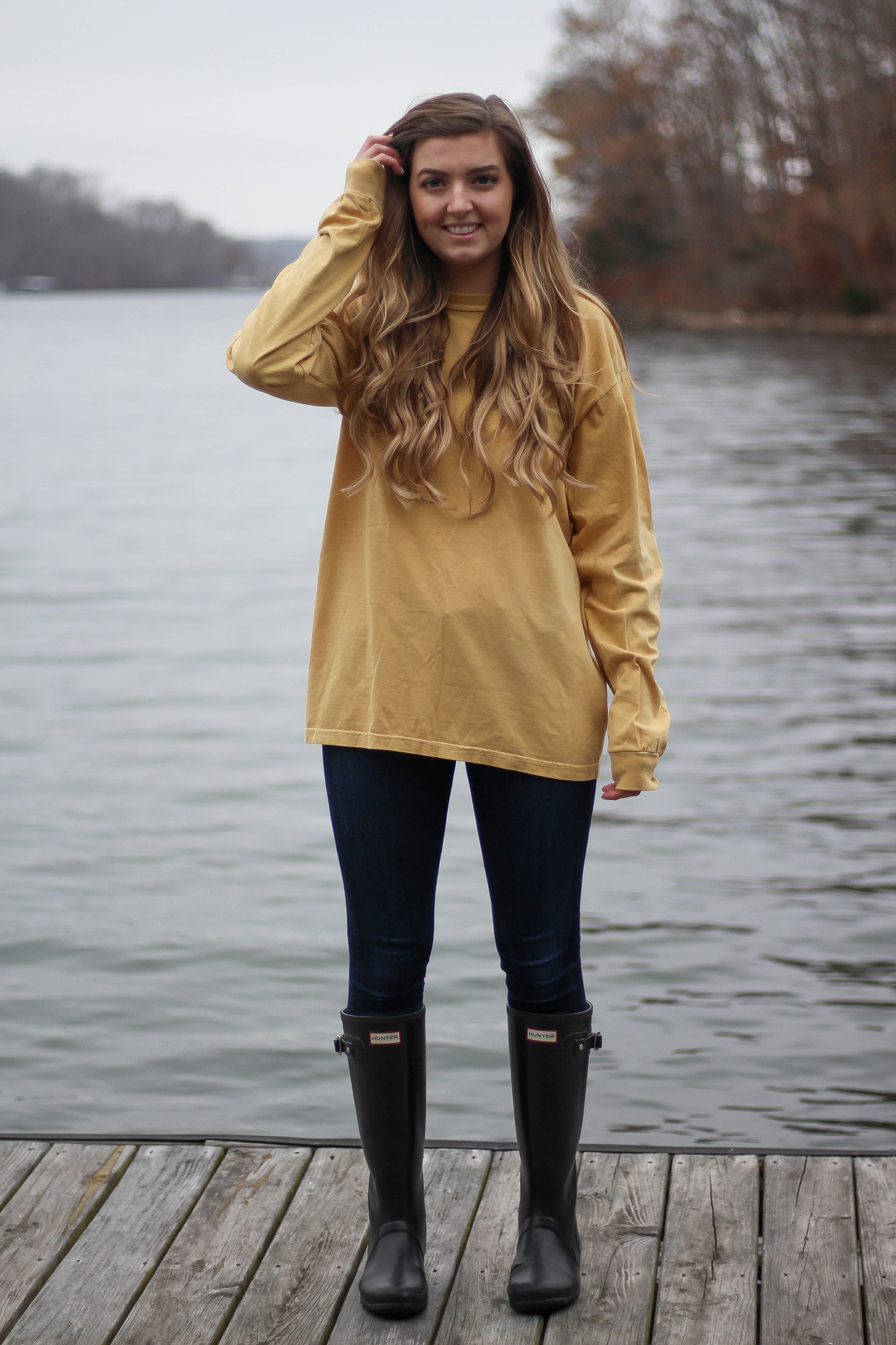 Perfect fall outfit including a Barbour coat, United tee fall t-shirt, and black hunter boots. If you want to know how to style hunter boots this is it! Check it out on my fashion blog daily dose of charm by Lauren Lindmark dailydoseofcharm.com