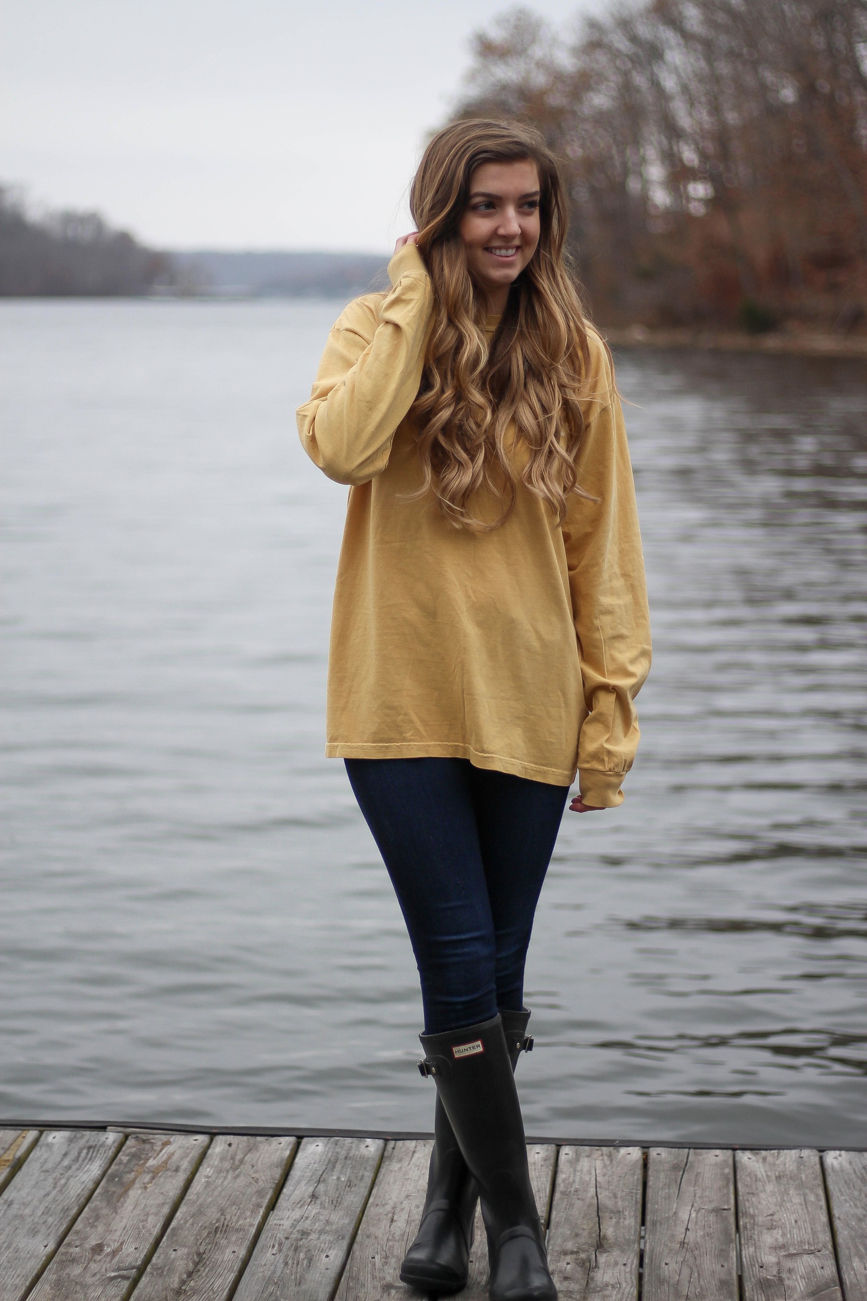 Perfect fall outfit including a Barbour coat, United tee fall t-shirt, and black hunter boots. If you want to know how to style hunter boots this is it! Check it out on my fashion blog daily dose of charm by Lauren Lindmark dailydoseofcharm.com