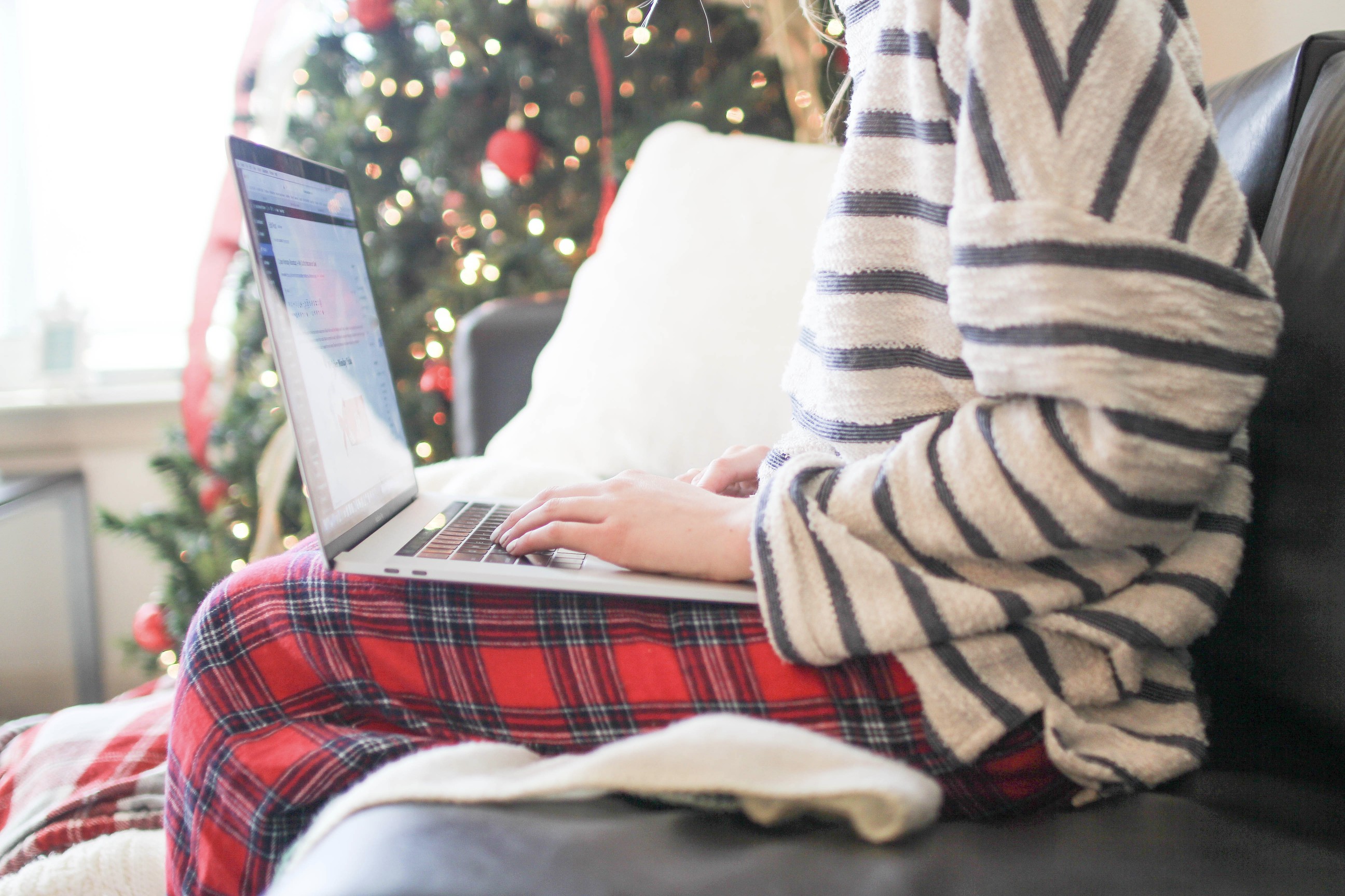 Christmas tree, MacBook, flannel, cozy blanket, winter necessities, on the blog dailydoseofcharm.com by Lauren Lindmark