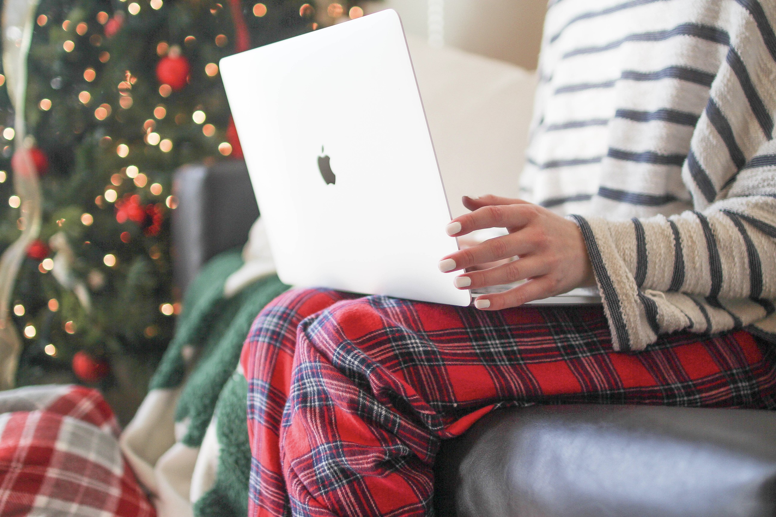 Christmas tree, MacBook, flannel, cozy blanket, winter necessities, on the blog dailydoseofcharm.com by Lauren Lindmark