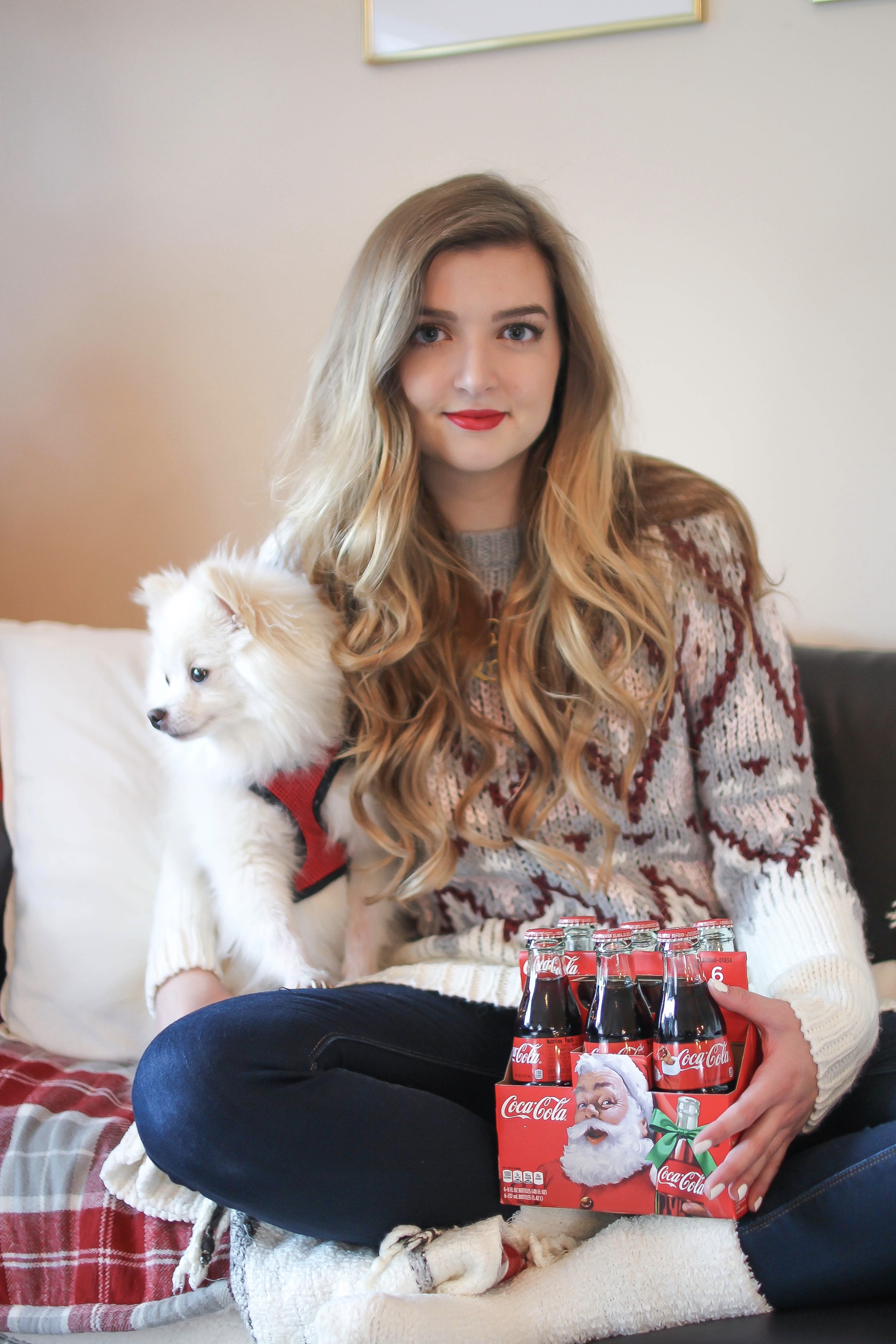 SLEIGH YOUR LOOK! Adorable oversized sweater with fun colors and pattern. Super cozy winter outfit. Pomeranian puppy, white Pomeranian, miniature Pomeranian, toy Pomeranian, red lips and curled hair by Lauren Lindmark dailydoseofcharm.com daily dose of charm