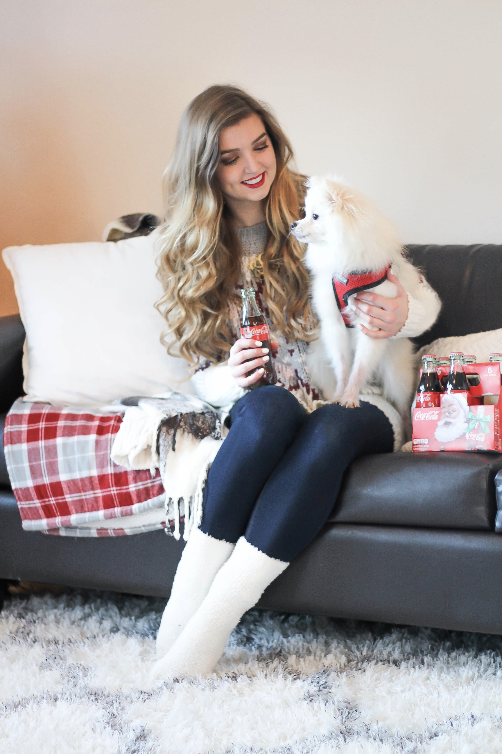 SLEIGH YOUR LOOK! Adorable oversized sweater with fun colors and pattern. Super cozy winter outfit. Pomeranian puppy, white Pomeranian, miniature Pomeranian, toy Pomeranian, red lips and curled hair by Lauren Lindmark dailydoseofcharm.com daily dose of charm