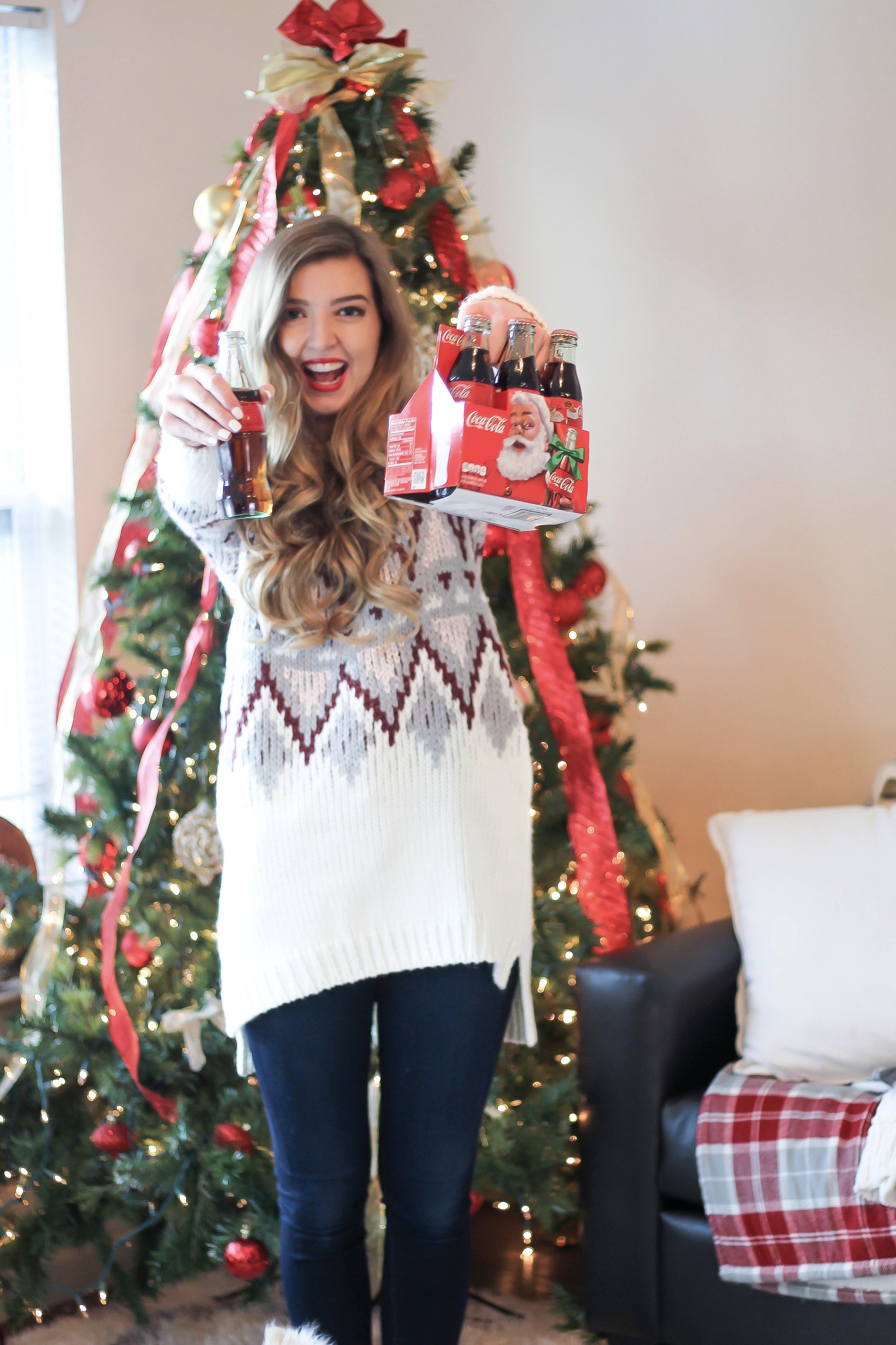 SLEIGH YOUR LOOK! Adorable oversized sweater with fun colors and pattern. Super cozy winter outfit. Pomeranian puppy, white Pomeranian, miniature Pomeranian, toy Pomeranian, red lips and curled hair by Lauren Lindmark dailydoseofcharm.com daily dose of charm