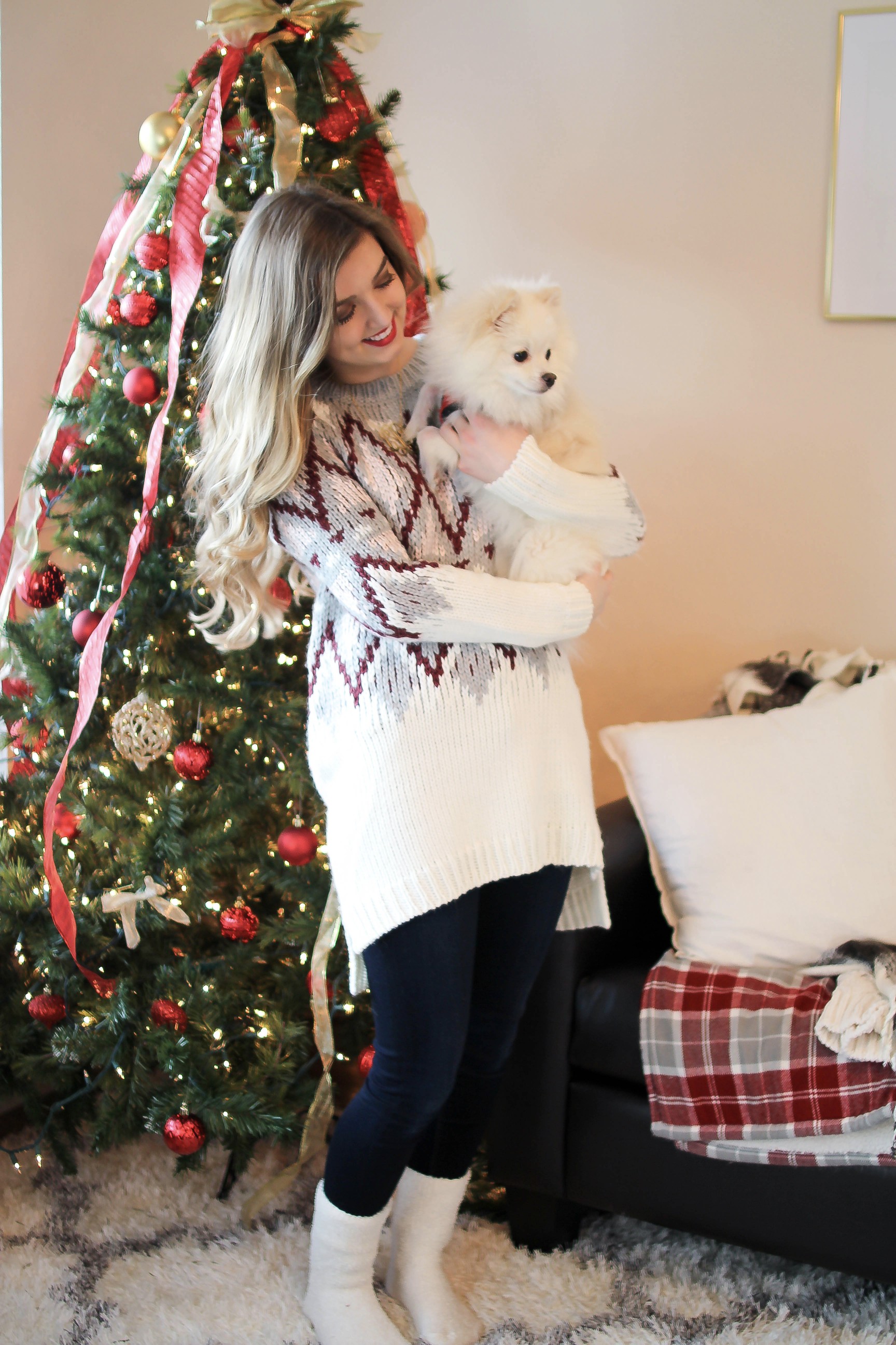 SLEIGH YOUR LOOK! Adorable oversized sweater with fun colors and pattern. Super cozy winter outfit. Pomeranian puppy, white Pomeranian, miniature Pomeranian, toy Pomeranian, red lips and curled hair by Lauren Lindmark dailydoseofcharm.com daily dose of charm