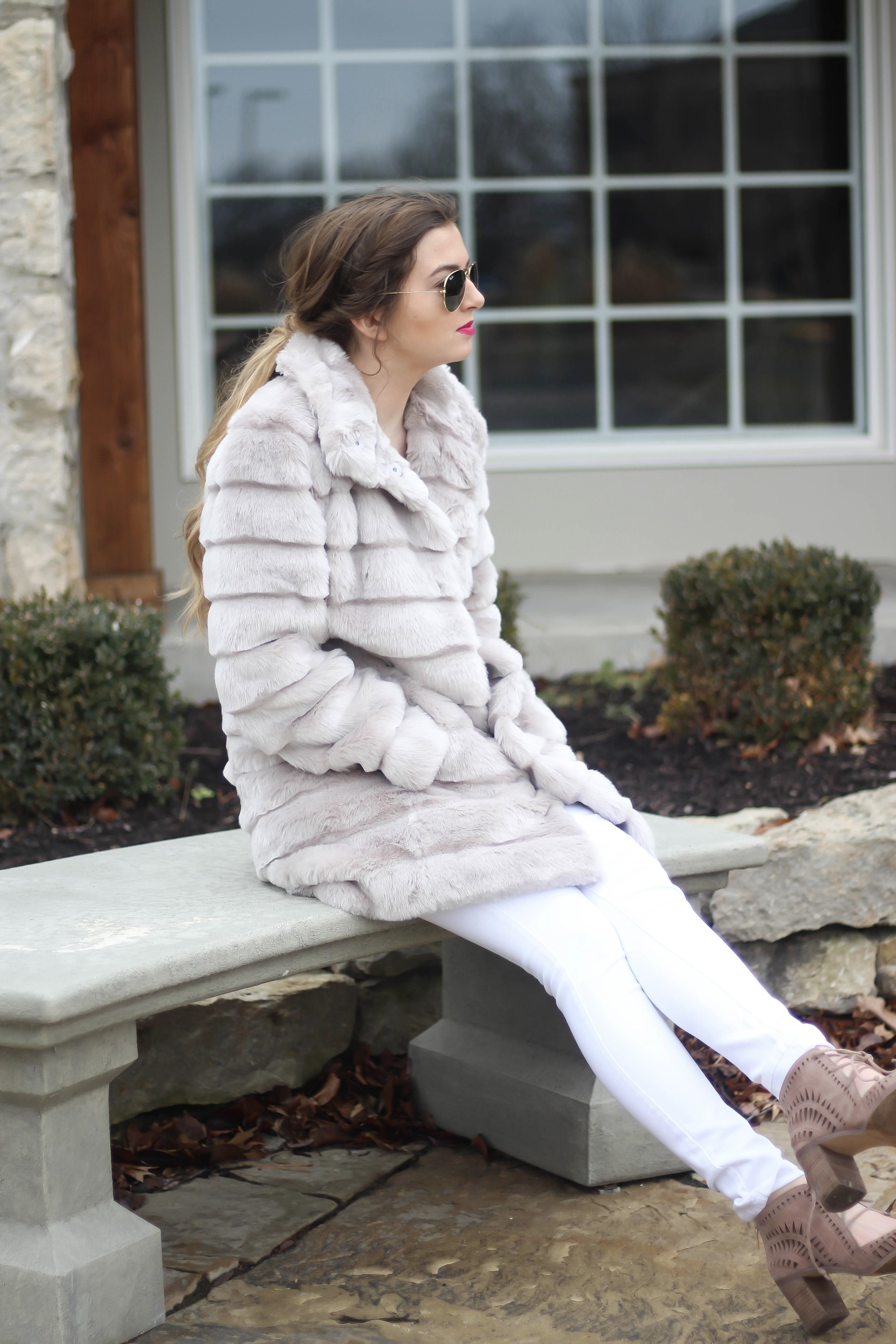 Fur coats are a closet necessity! This faux fur coat is my favorite and look adorable with white pants, cute heels, and bright pink lips! By Lauren Lindmark on dailydoseofcharm.com daily dose of charm