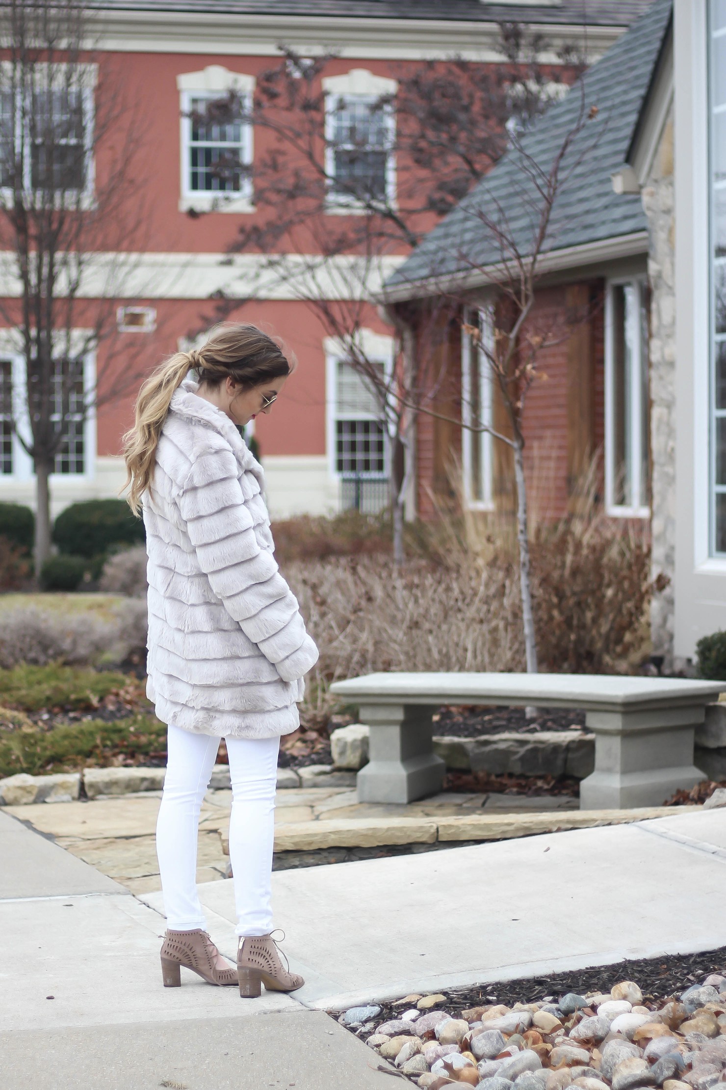 Fur coats are a closet necessity! This faux fur coat is my favorite and look adorable with white pants, cute heels, and bright pink lips! By Lauren Lindmark on dailydoseofcharm.com daily dose of charm