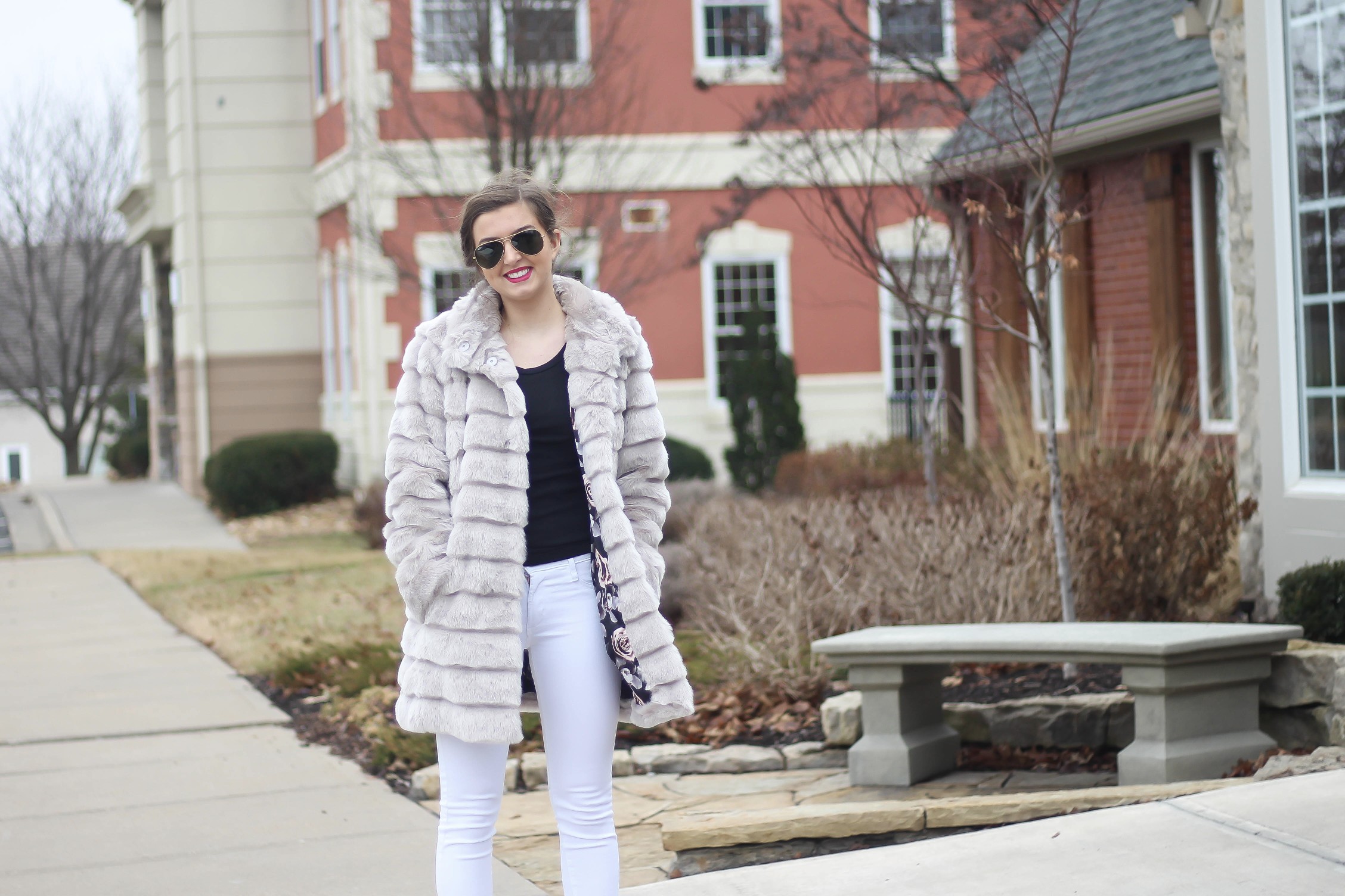 Fur coats are a closet necessity! This faux fur coat is my favorite and look adorable with white pants, cute heels, and bright pink lips! By Lauren Lindmark on dailydoseofcharm.com daily dose of charm