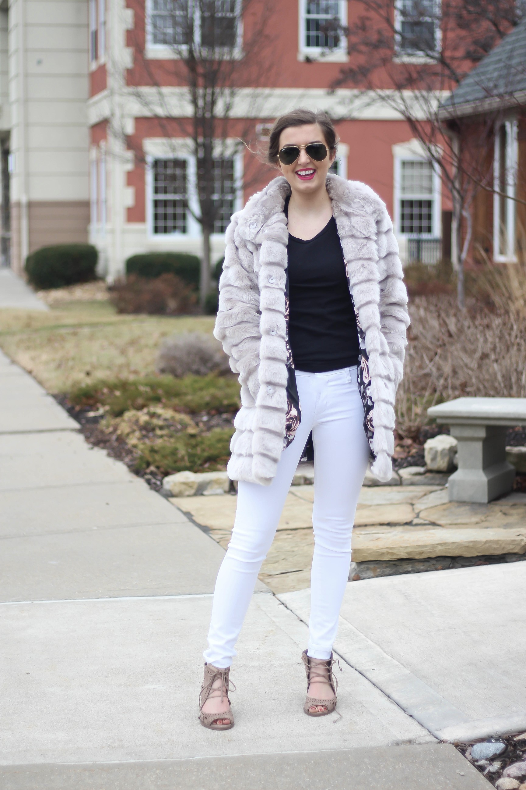 Fur coats are a closet necessity! This faux fur coat is my favorite and look adorable with white pants, cute heels, and bright pink lips! By Lauren Lindmark on dailydoseofcharm.com daily dose of charm
