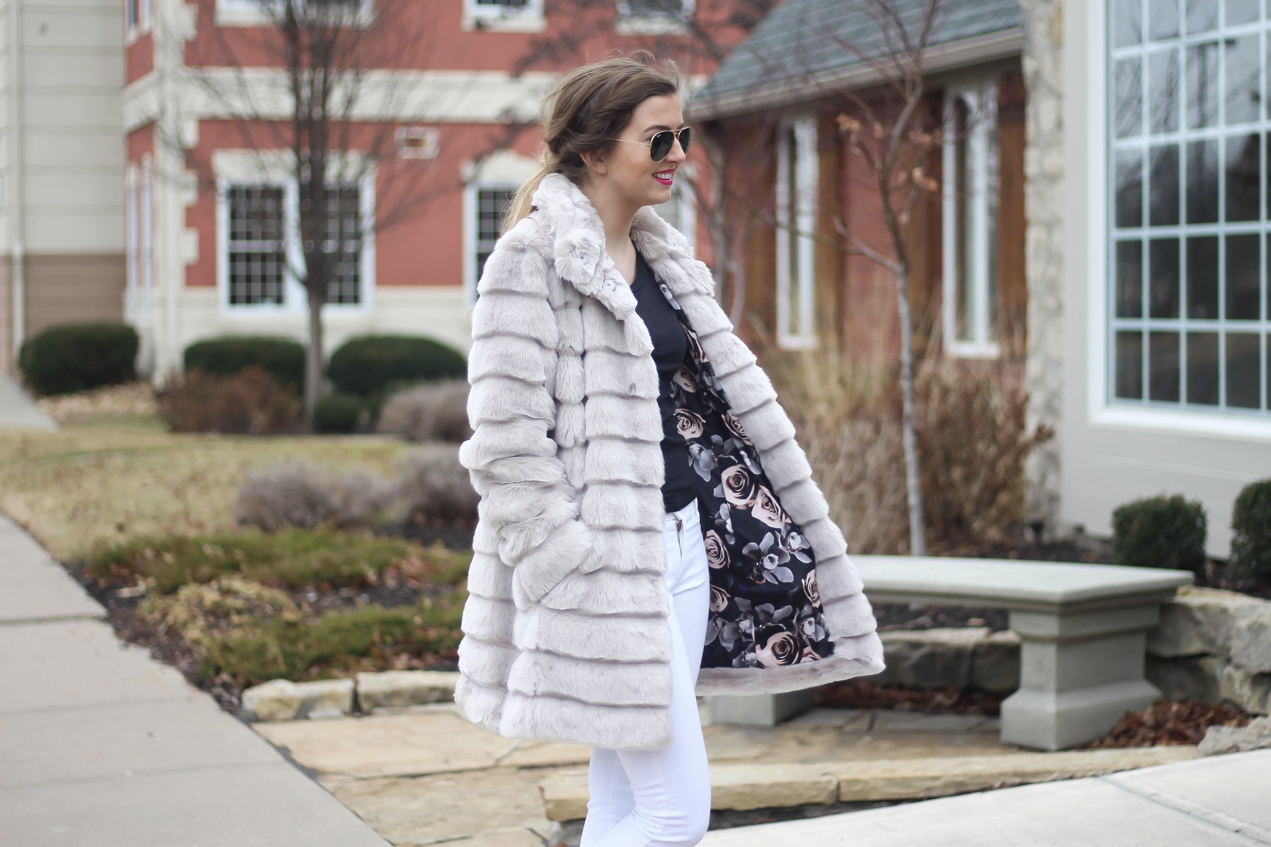 Fur coats are a closet necessity! This faux fur coat is my favorite and look adorable with white pants, cute heels, and bright pink lips! By Lauren Lindmark on dailydoseofcharm.com daily dose of charm
