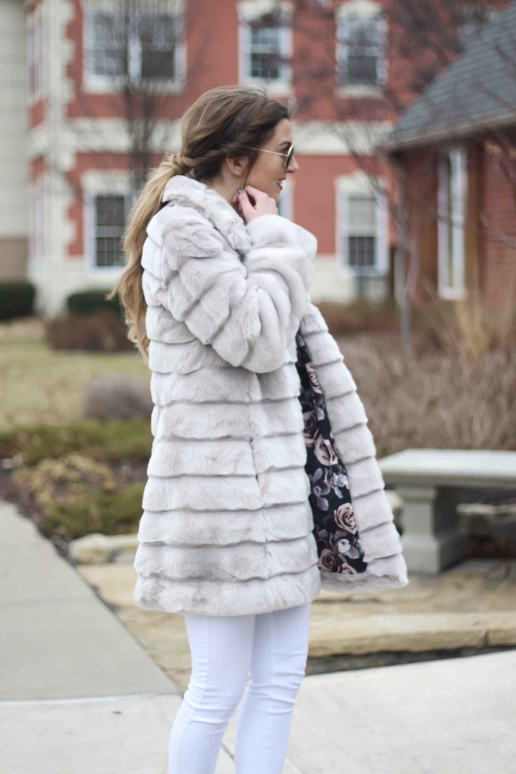 Fur coats are a closet necessity! This faux fur coat is my favorite and look adorable with white pants, cute heels, and bright pink lips! By Lauren Lindmark on dailydoseofcharm.com daily dose of charm