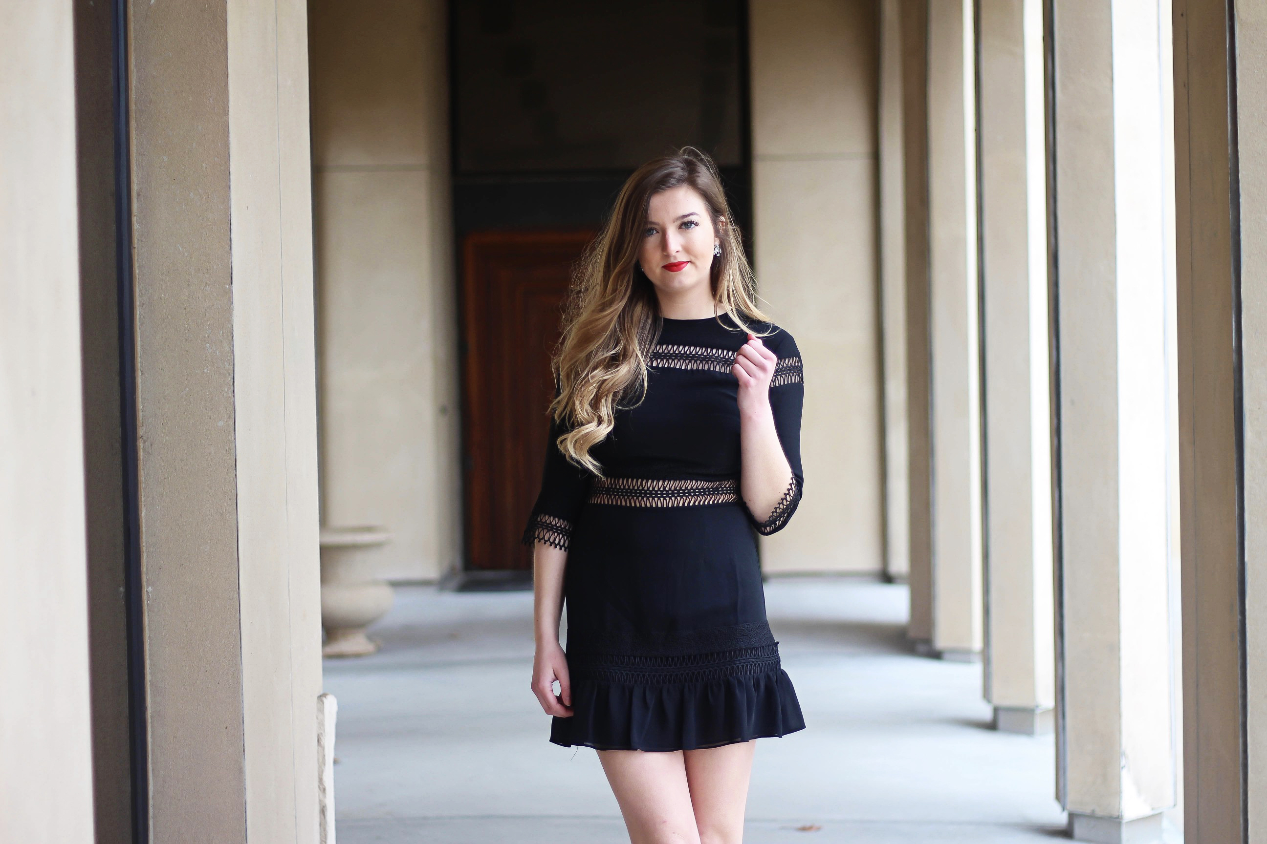 Valentines Day outfit! This little black dress is so perfect for any special occasion. I love the lace details around the waste and on the sleeves! I paired it with some chunky black heels, cluster earrings, and red lips! Plus of course some roses! By Lauren Lindmark on daily dose of charm dailydoseofcharm.com