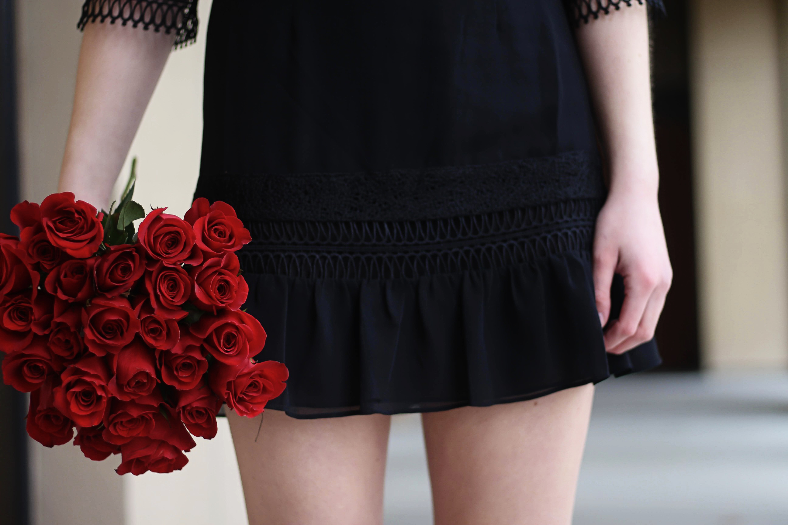 Valentines Day outfit! This little black dress is so perfect for any special occasion. I love the lace details around the waste and on the sleeves! I paired it with some chunky black heels, cluster earrings, and red lips! Plus of course some roses! By Lauren Lindmark on daily dose of charm dailydoseofcharm.com