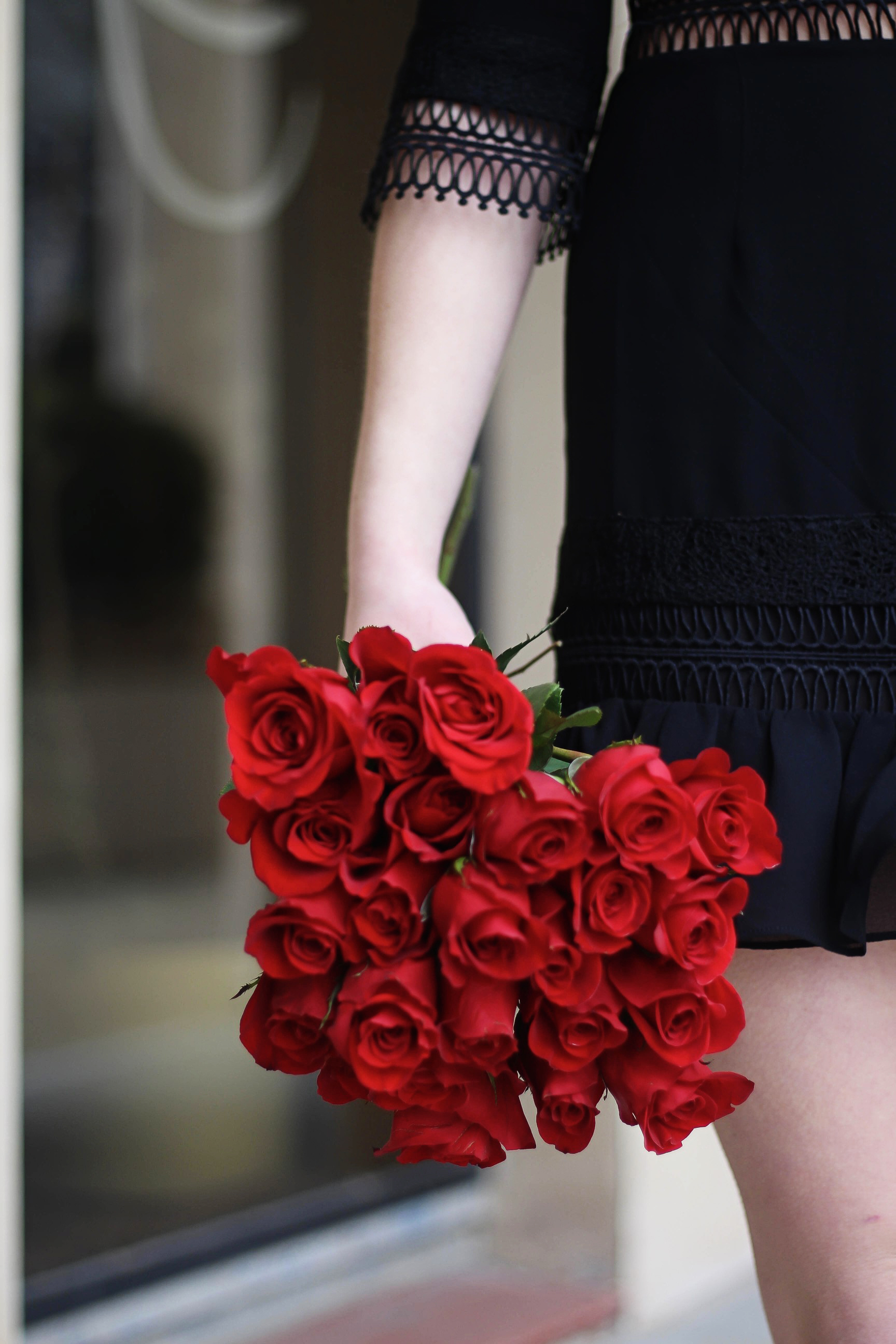 Valentines Day outfit! This little black dress is so perfect for any special occasion. I love the lace details around the waste and on the sleeves! I paired it with some chunky black heels, cluster earrings, and red lips! Plus of course some roses! By Lauren Lindmark on daily dose of charm dailydoseofcharm.com