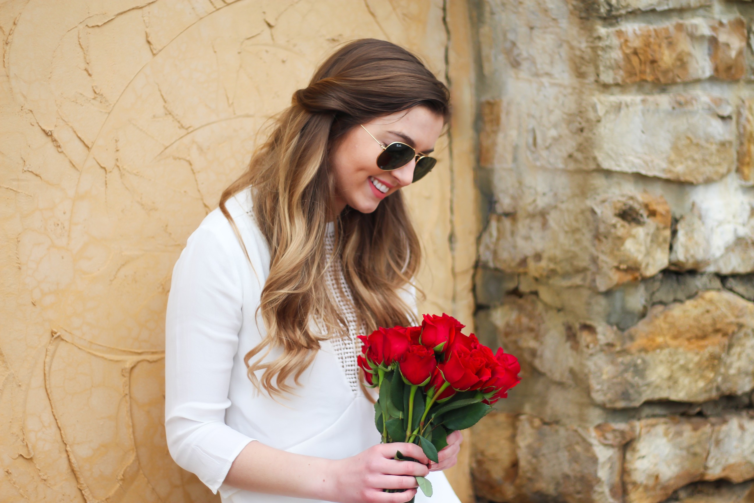 Perfect Valentine's Day look! If you need to know what to wear for Valentines Day look no further! Love this white deep vneck lace dress, especially with hunter green booties! I paired it with white Kendra Scott earrings and my ray ban aviators! By Lauren Lindmark daily dose of charm on dailydoseofcharm.com 