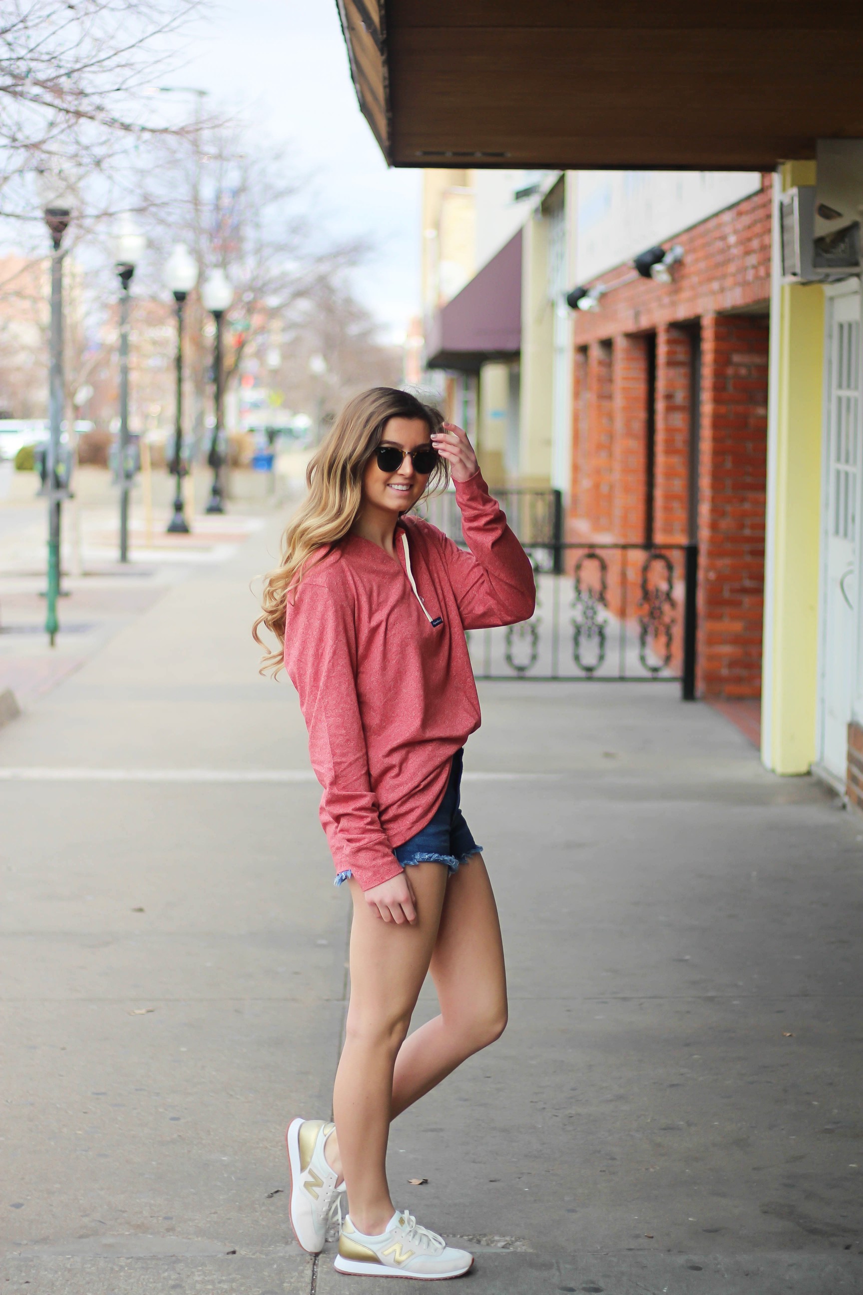 This slouchy boyfriend tee is so comfortable! I love comfy shirts, this one is by Lauren James and comes in so many colors! I paired it with Ray Ban Clubmaster Sunglasses, shorts, and my favorite Gold New Balance sneakers! By Lauren Lindmark and daily dose of charm dailydoseofcharm.com