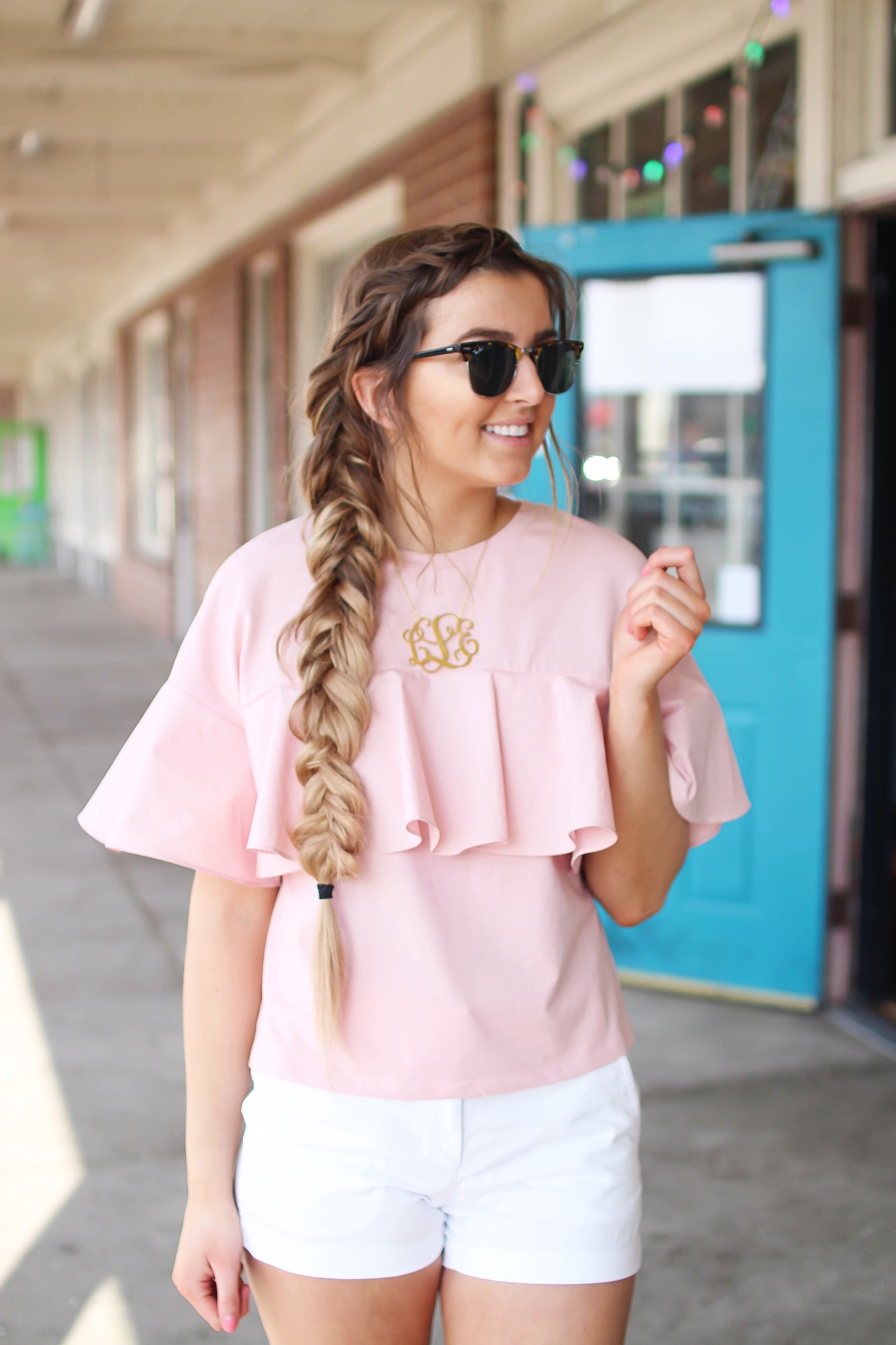 The cutest ruffle top you will ever find is only $35! I love this pink full shirt, I can't stop wearing it! I paired it with my white j.crew chino shorts and my 2.5" monogram necklace. I am also wearing my favorite ray ban club master sunglasses. By Lauren Lindmark on dailydoseofcharm.com daily dose of charm