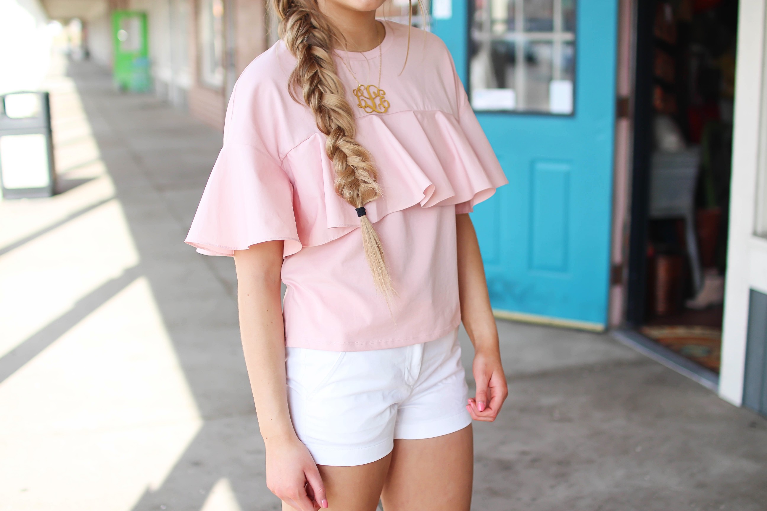 The cutest ruffle top you will ever find is only $35! I love this pink full shirt, I can't stop wearing it! I paired it with my white j.crew chino shorts and my 2.5" monogram necklace. I am also wearing my favorite ray ban club master sunglasses. By Lauren Lindmark on dailydoseofcharm.com daily dose of charm