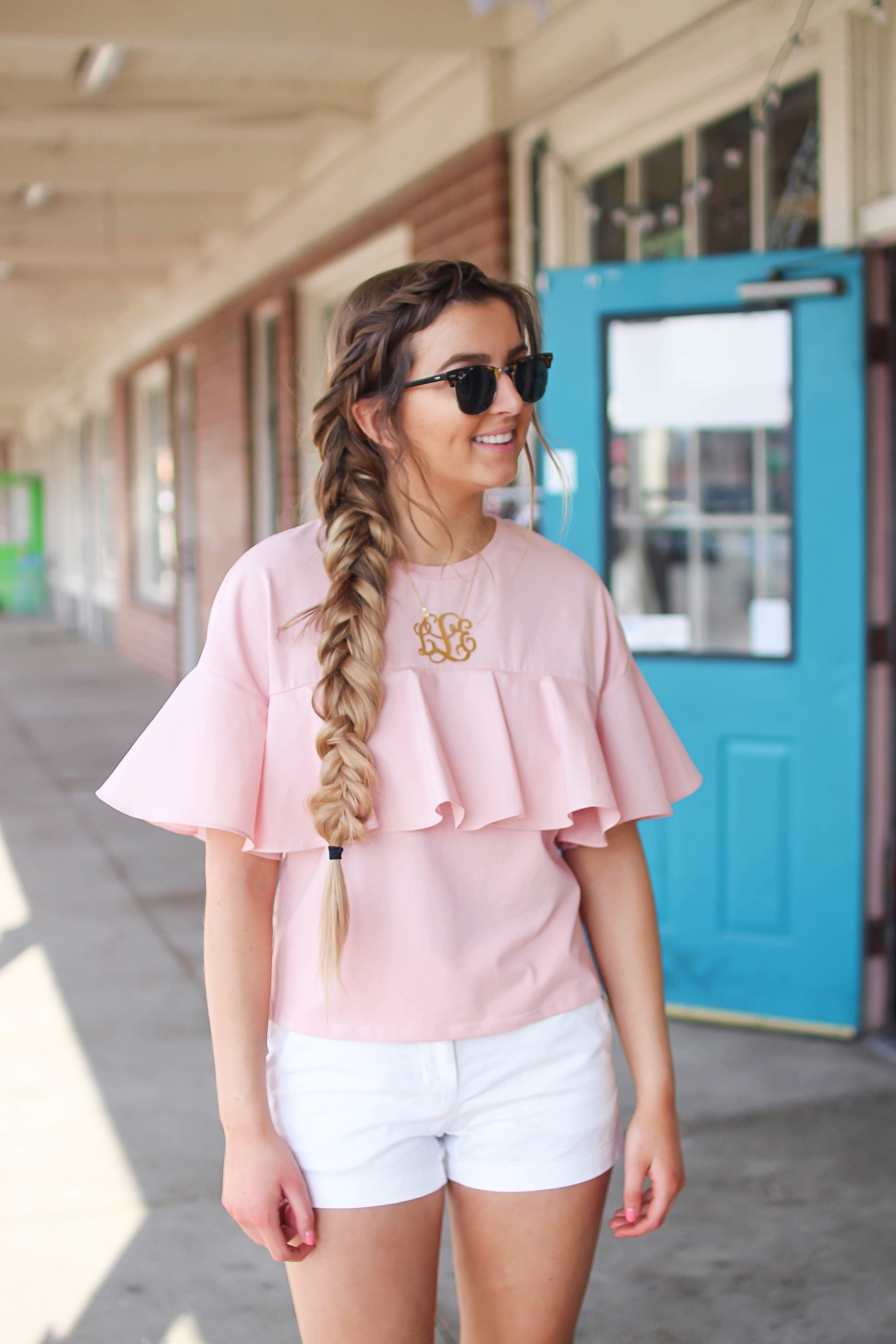 The cutest ruffle top you will ever find is only $35! I love this pink full shirt, I can't stop wearing it! I paired it with my white j.crew chino shorts and my 2.5" monogram necklace. I am also wearing my favorite ray ban club master sunglasses. By Lauren Lindmark on dailydoseofcharm.com daily dose of charm