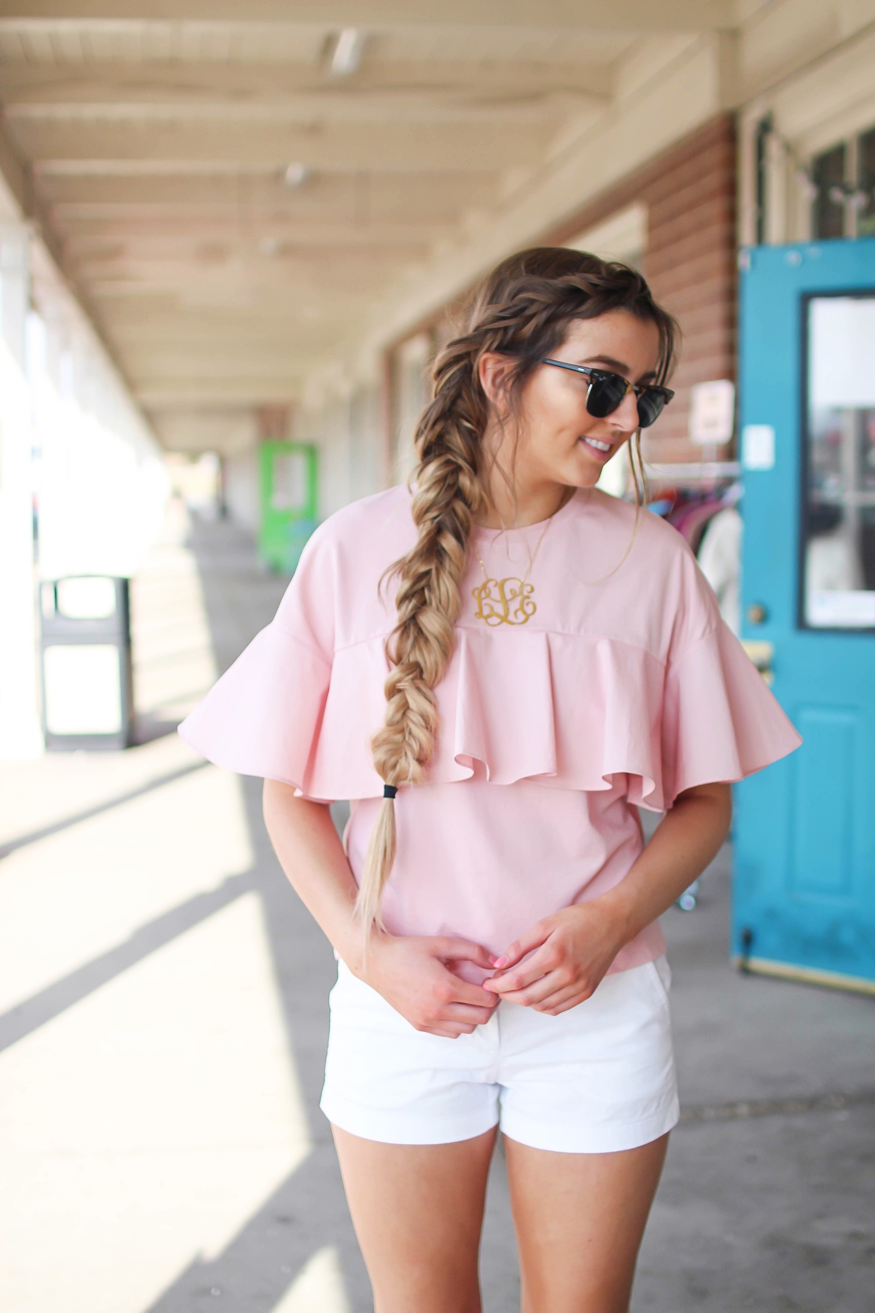 The cutest ruffle top you will ever find is only $35! I love this pink full shirt, I can't stop wearing it! I paired it with my white j.crew chino shorts and my 2.5" monogram necklace. I am also wearing my favorite ray ban club master sunglasses. By Lauren Lindmark on dailydoseofcharm.com daily dose of charm