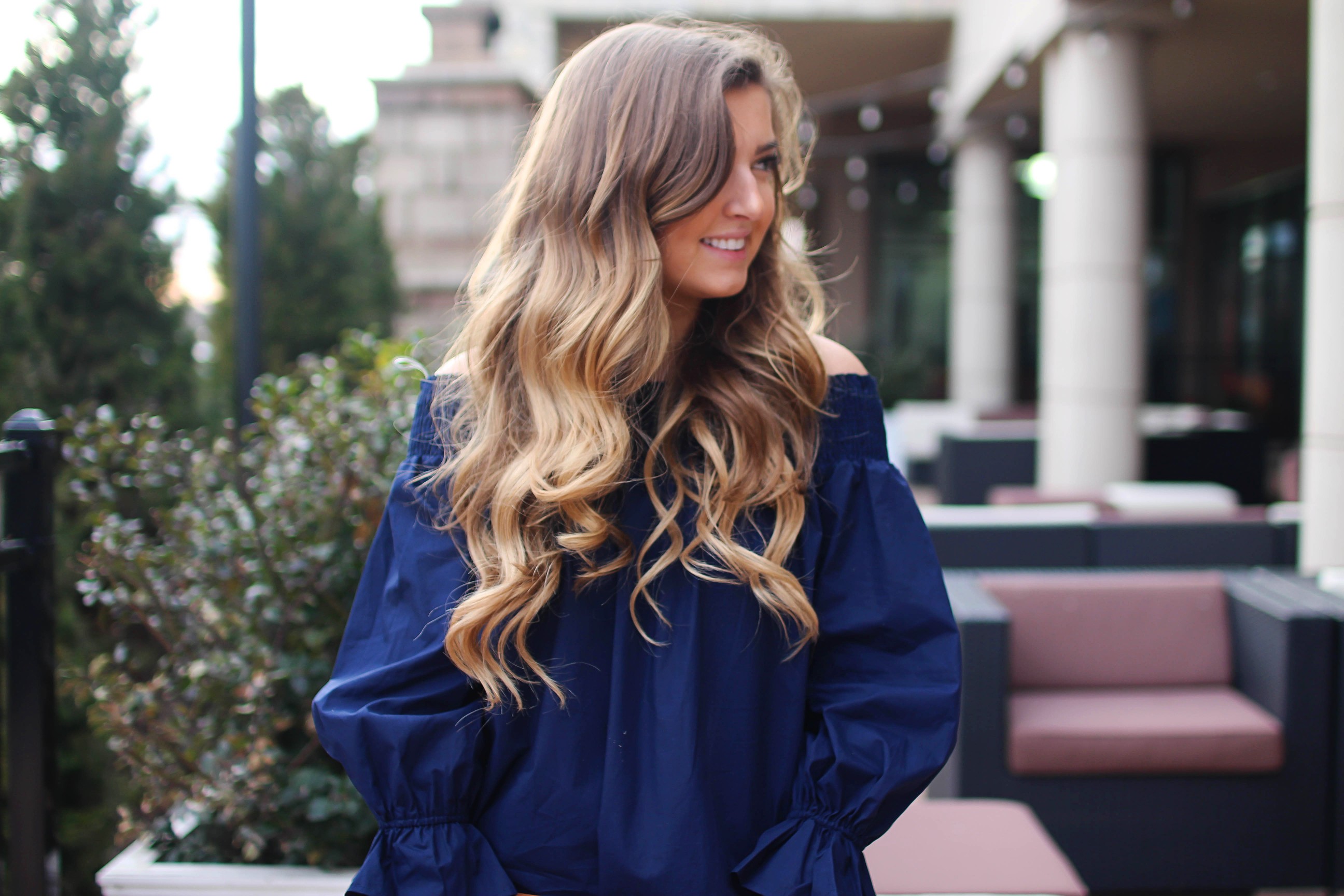 The cutest and most unique off the shoulder top you'll ever find! I love the bow on the back of the off the shoulder top and the unique sleeves. I paired it with the cutest tassel clutch and Tory Burch sandals! By Lauren Lindmark on daily dose of charm dailydoseofcharm.com