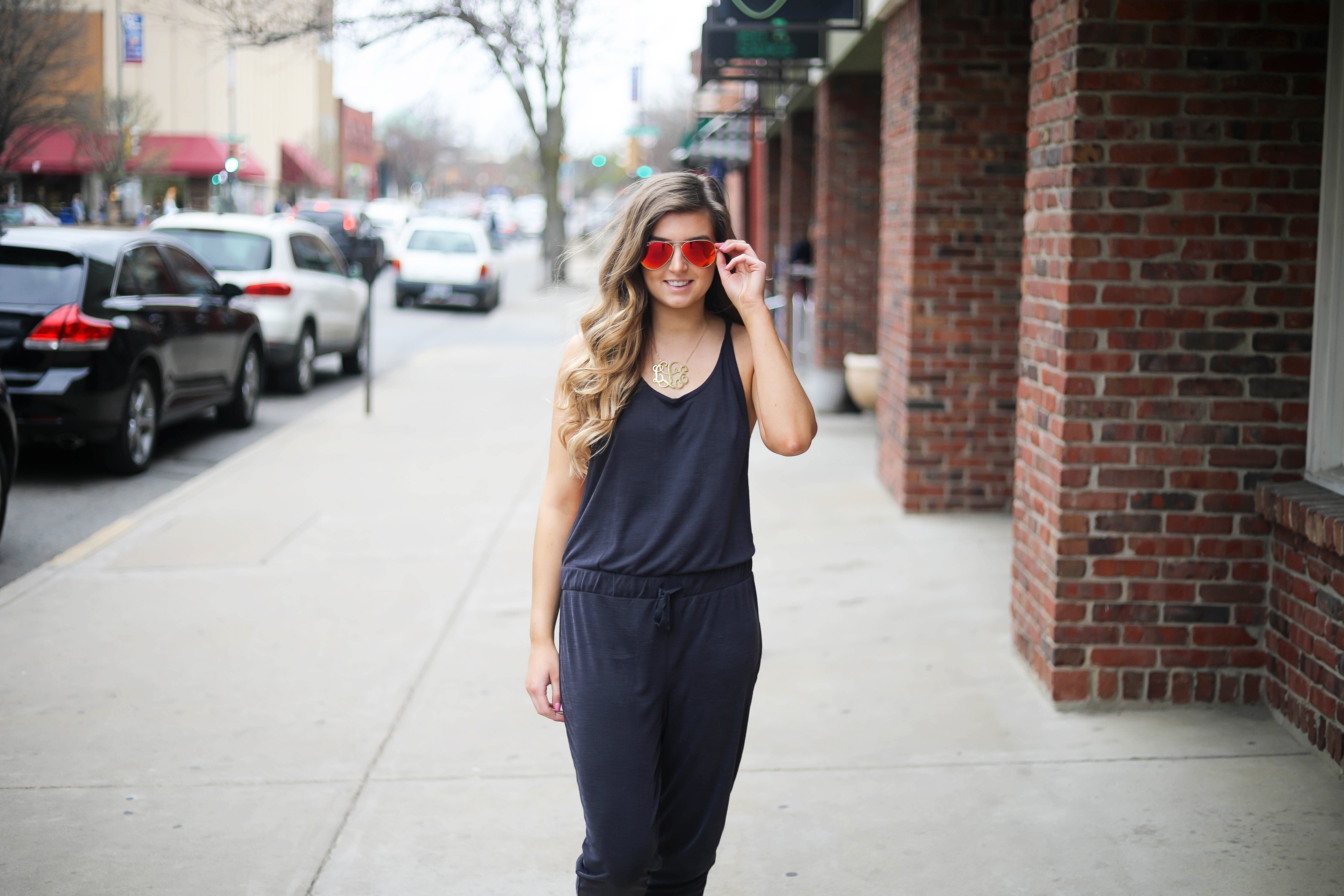 The cutest jumpsuit that is open on the sides and slouchy! I love comfy jumpsuits and this one is my favorite! Paired with red mirrored ray ban aviators and tory burch miller sandals! By Lauren Lindmark dailydoseofcharm.com daily dose of charm