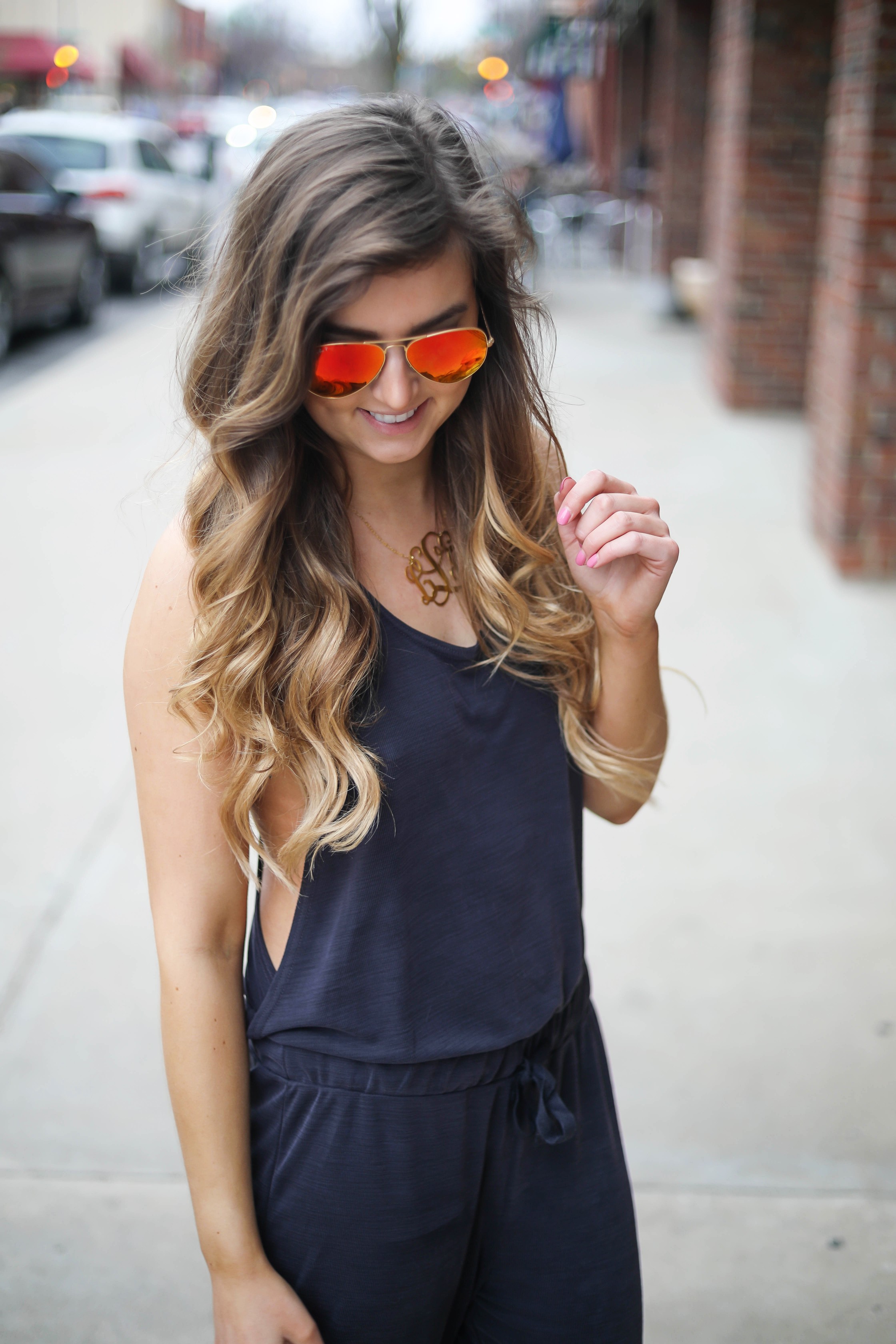 The cutest jumpsuit that is open on the sides and slouchy! I love comfy jumpsuits and this one is my favorite! Paired with red mirrored ray ban aviators and tory burch miller sandals! By Lauren Lindmark dailydoseofcharm.com daily dose of charm