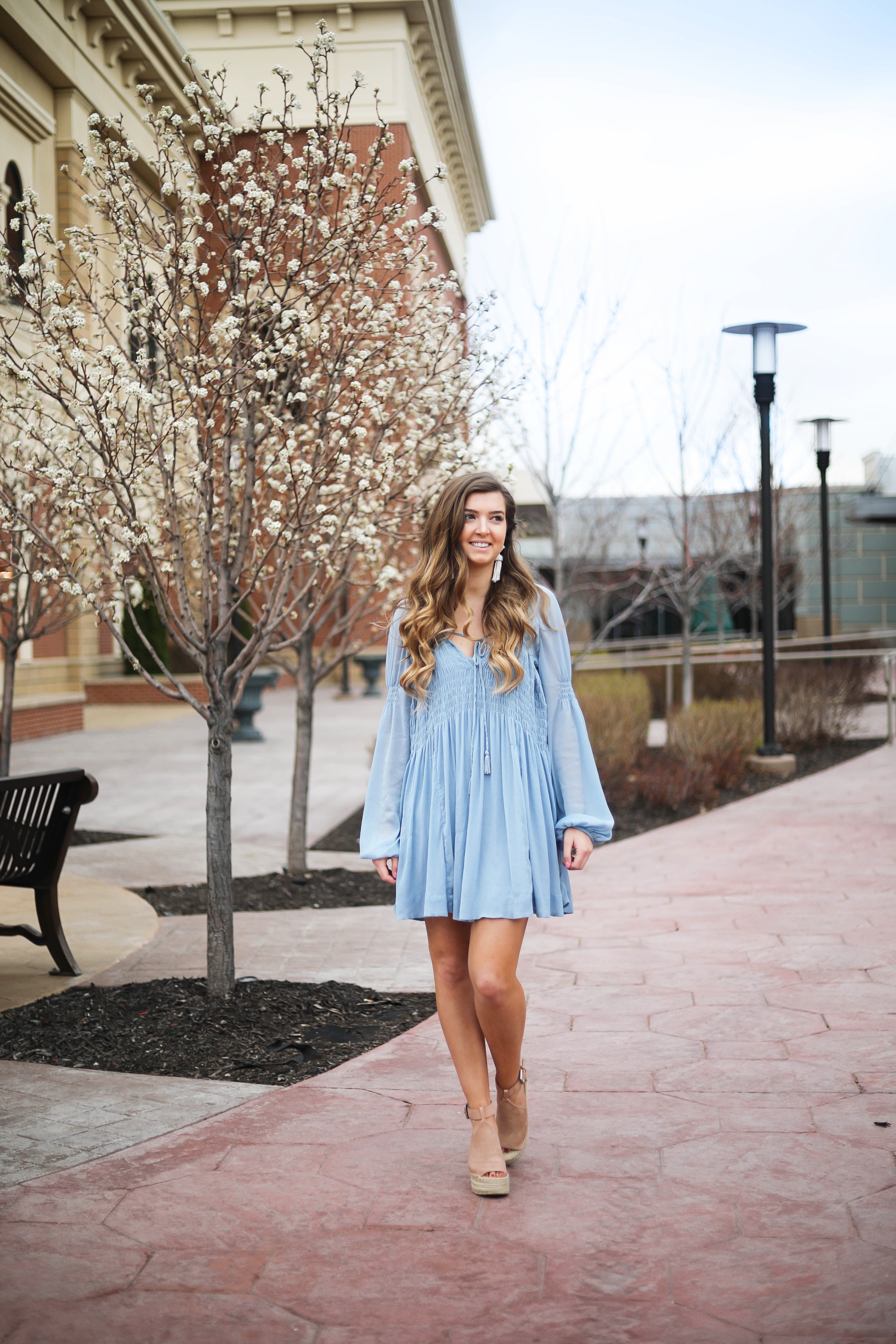 The prettiest flowy light blue dress up on the blog! Paired with Marc Fisher wedges and Lisi Lerch white tassel earrings. Details and links are all on the blog dailydoseofcharm.com daily dose of charm lauren Lindmark