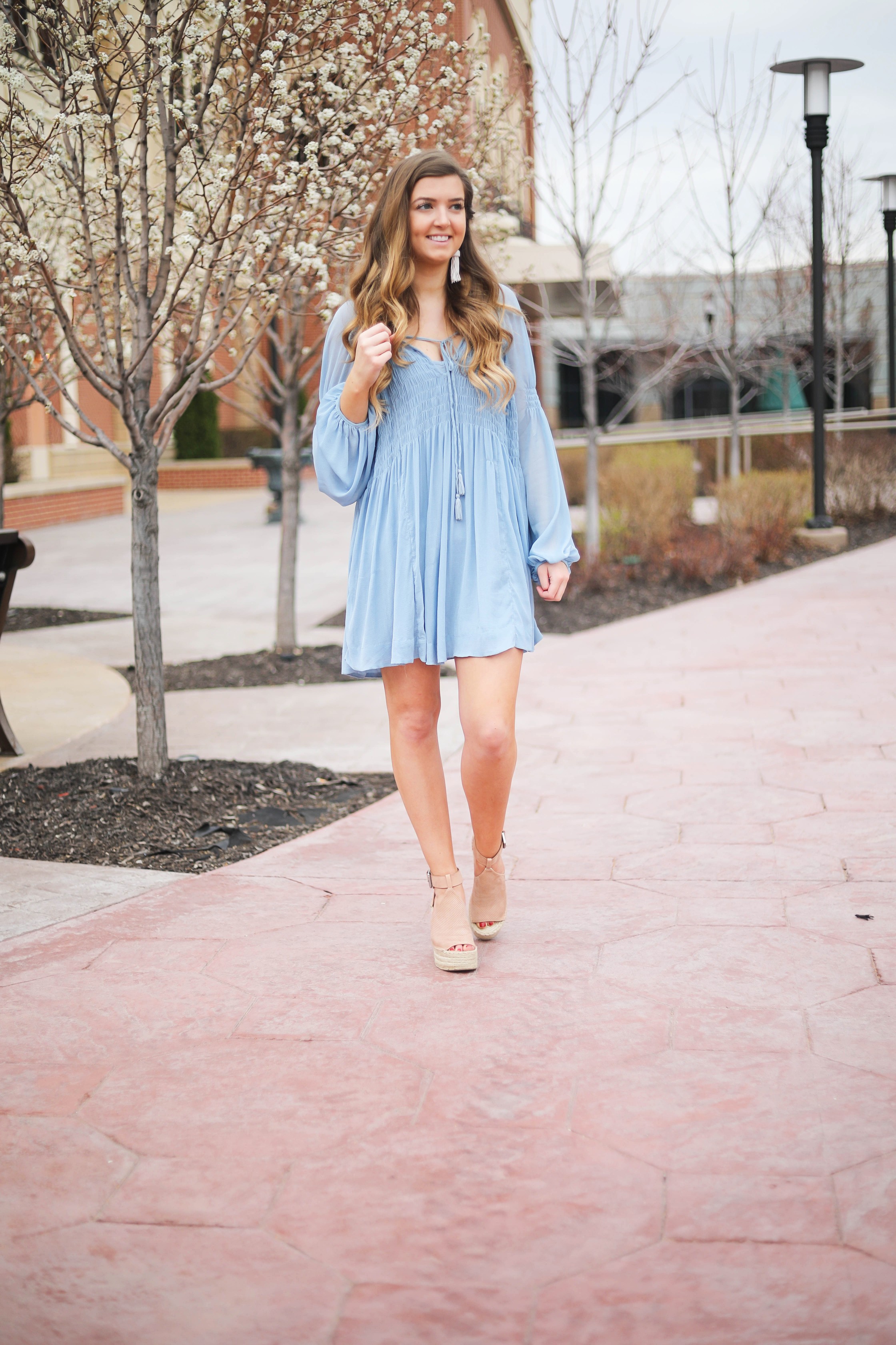 The prettiest flowy light blue dress up on the blog! Paired with Marc Fisher wedges and Lisi Lerch white tassel earrings. Details and links are all on the blog dailydoseofcharm.com daily dose of charm lauren Lindmark