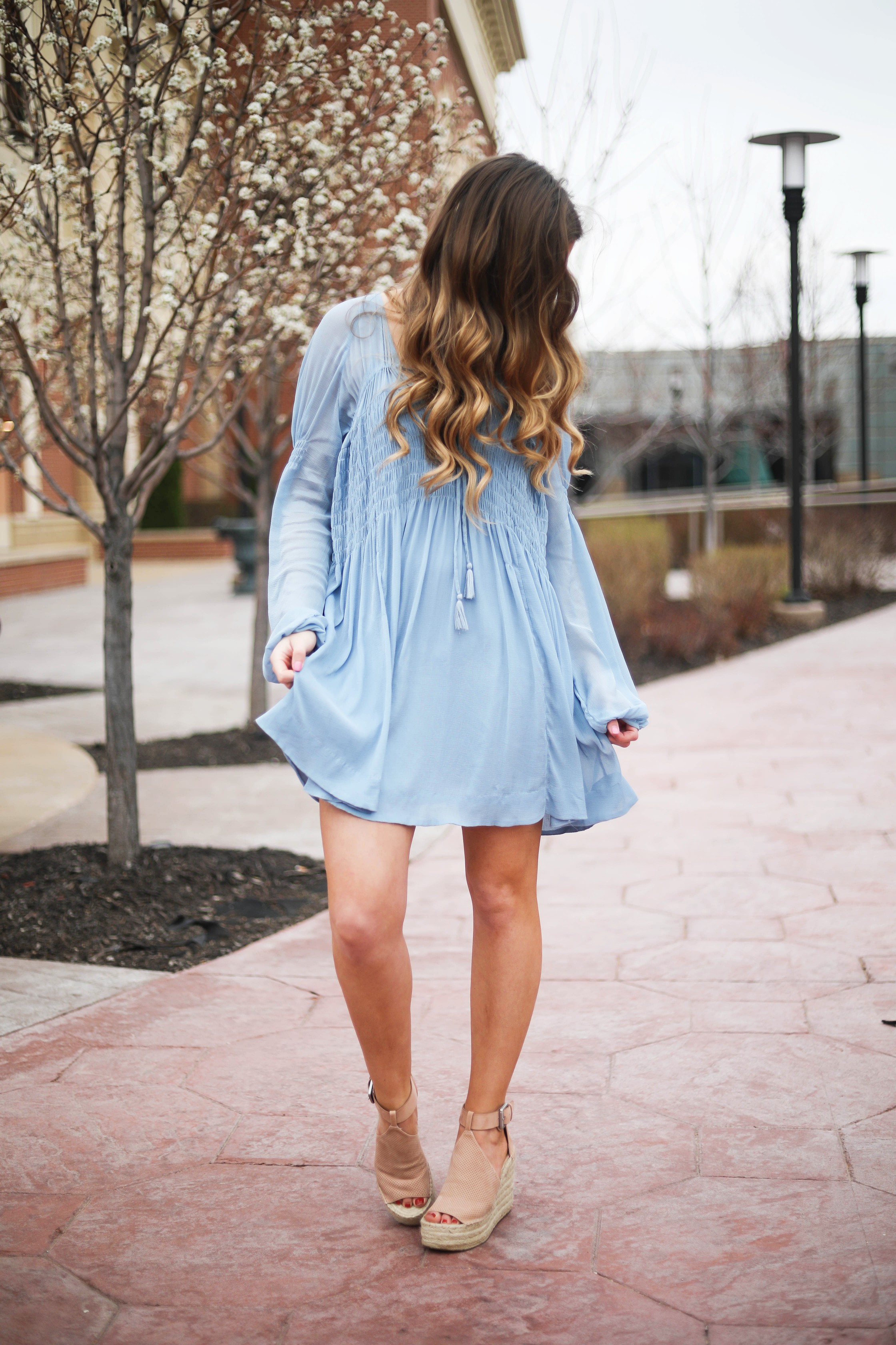 The prettiest flowy light blue dress up on the blog! Paired with Marc Fisher wedges and Lisi Lerch white tassel earrings. Details and links are all on the blog dailydoseofcharm.com daily dose of charm lauren Lindmark