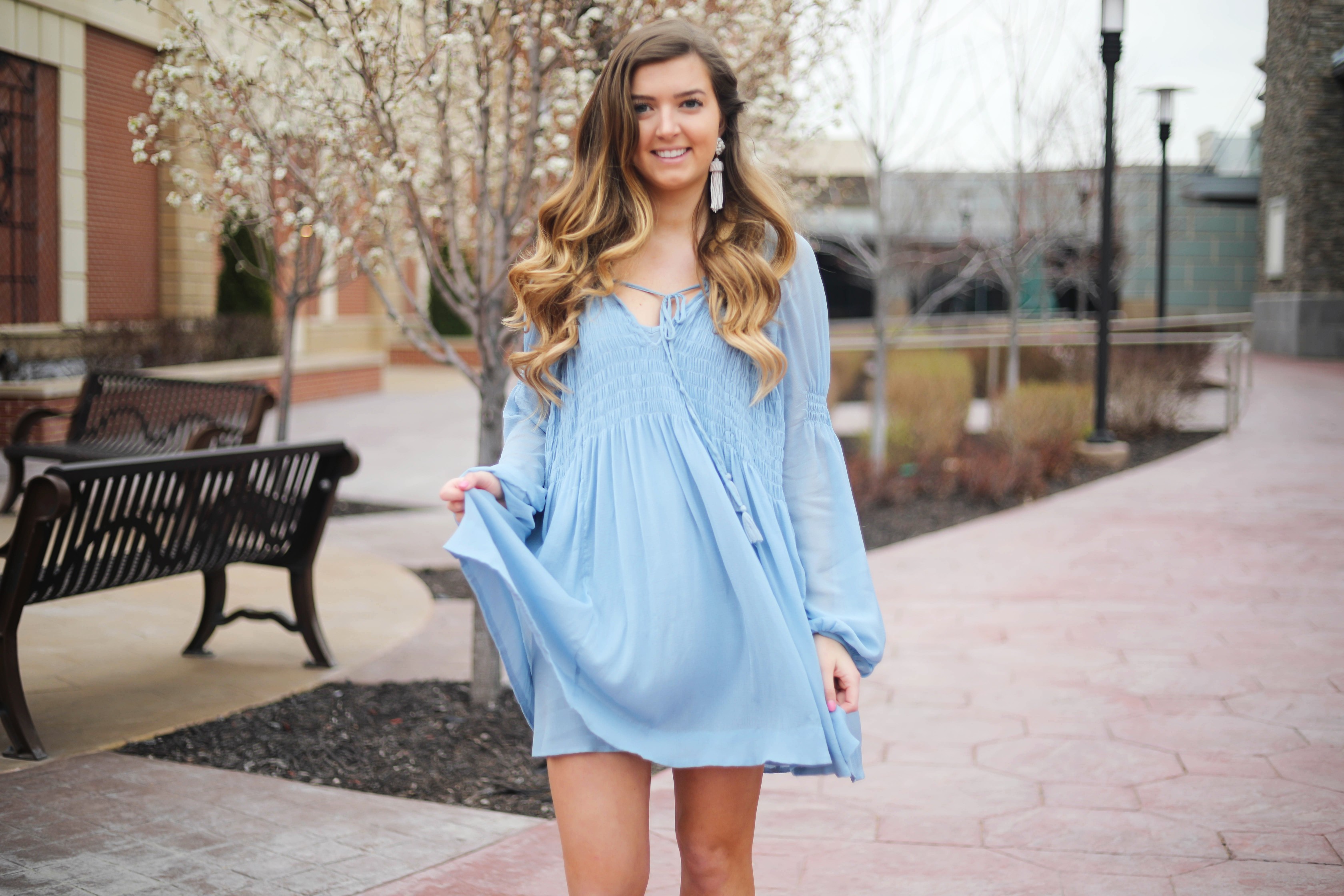The prettiest flowy light blue dress up on the blog! Paired with Marc Fisher wedges and Lisi Lerch white tassel earrings. Details and links are all on the blog dailydoseofcharm.com daily dose of charm lauren Lindmark