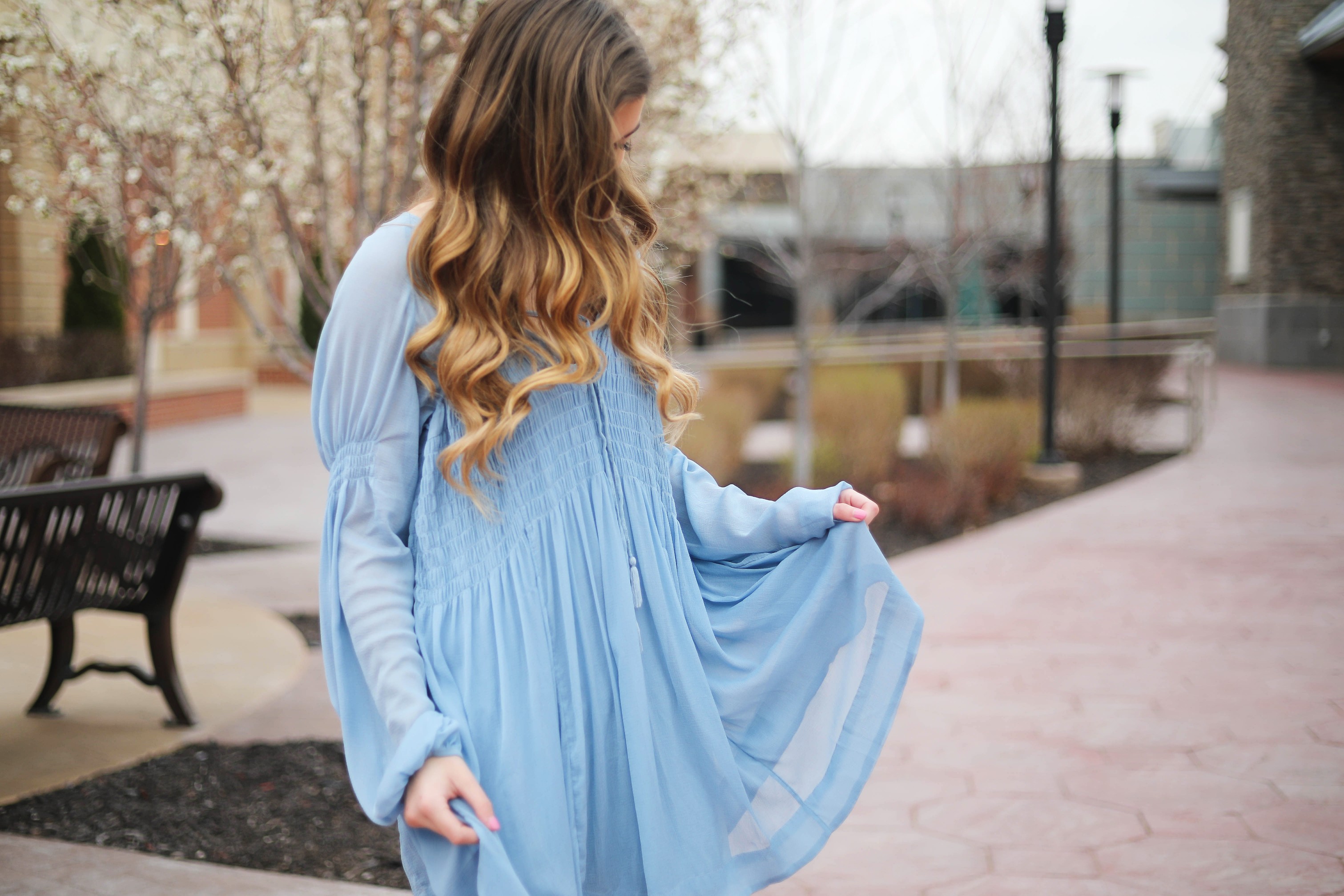 The prettiest flowy light blue dress up on the blog! Paired with Marc Fisher wedges and Lisi Lerch white tassel earrings. Details and links are all on the blog dailydoseofcharm.com daily dose of charm lauren Lindmark