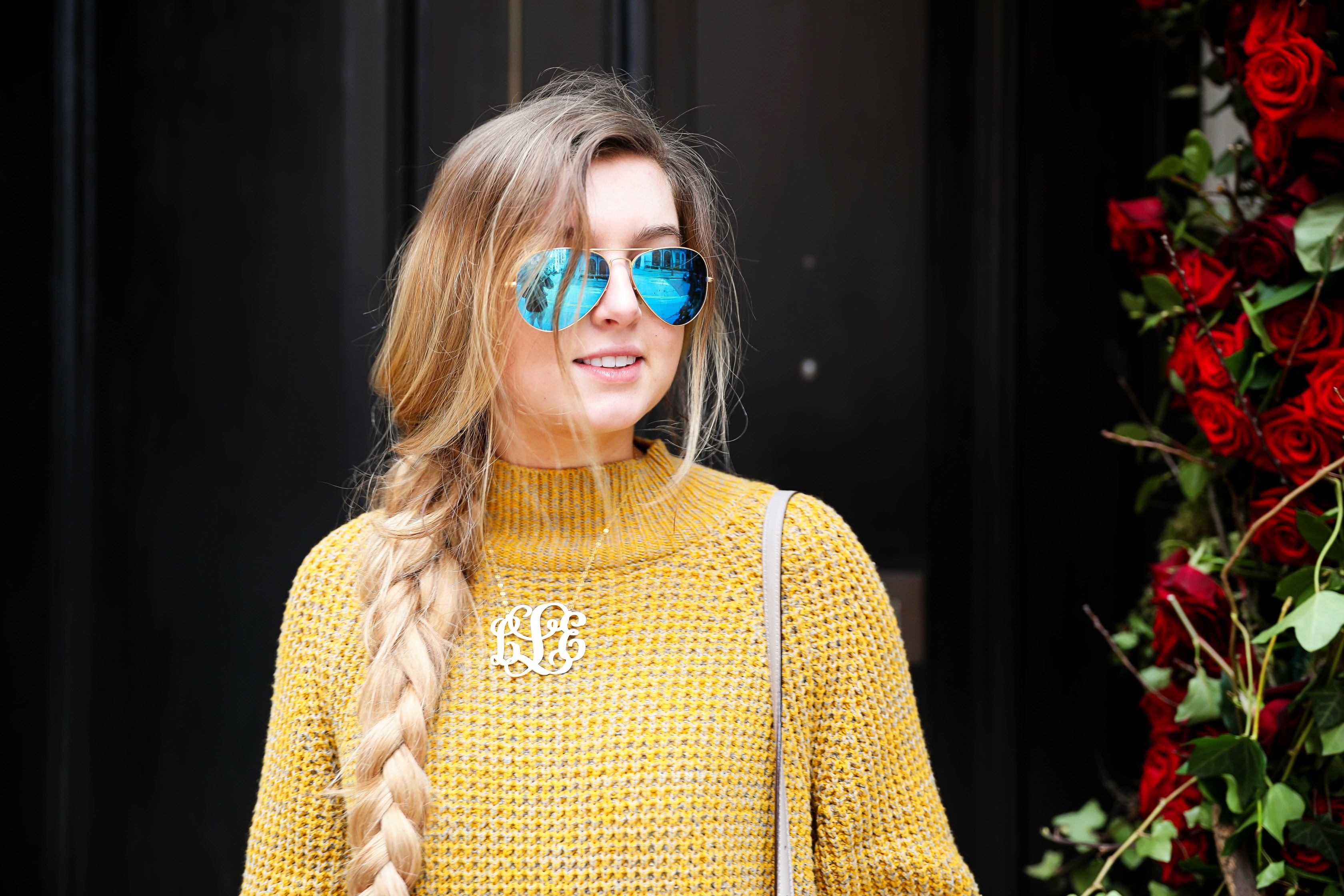 The cutest yellow sweater up on the blog! These photos were taken in front of the most beautiful roses in London! Cute London outfit! By Lauren Lindmark on dailydoseofcharm.com daily dose of charm