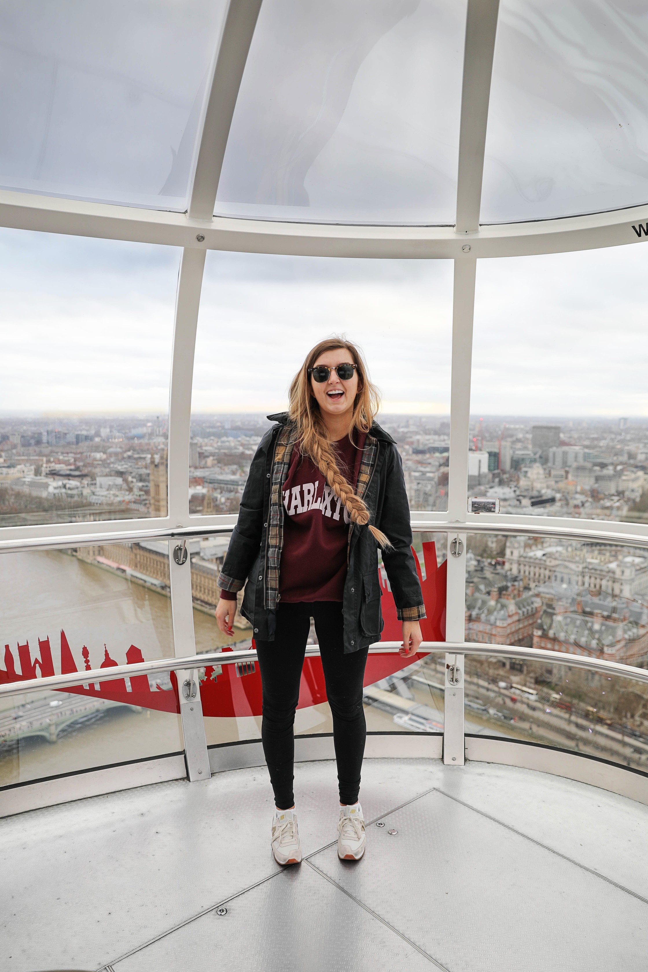 London Adventure post! Photos from the London Eye! Wearing a Barbour coat and England crewneck with my favorite gold sneakers by new balance! By Lauren Lindmark on daily dose of charm dailydoseofcharm.com