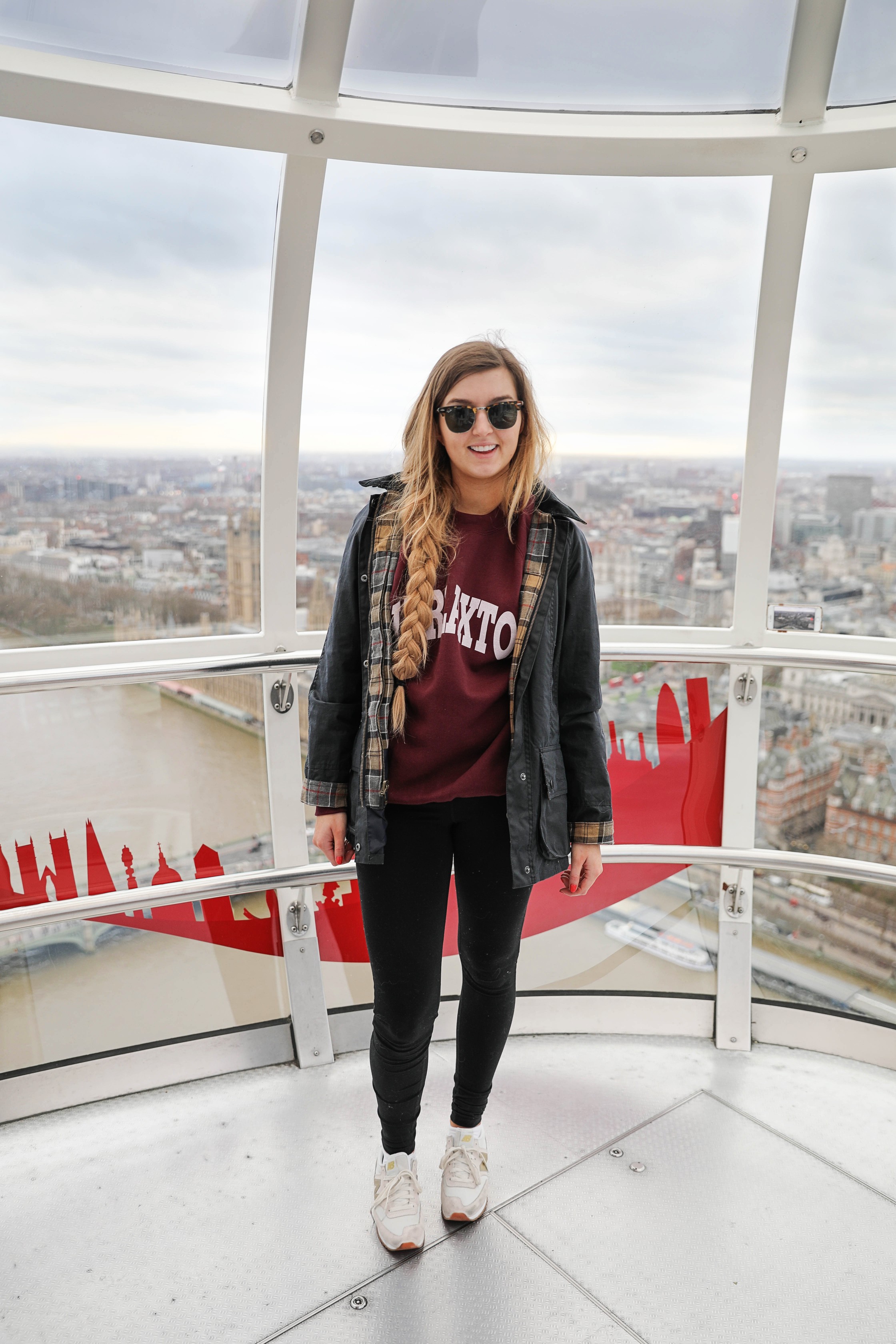 London Adventure post! Photos from the London Eye! Wearing a Barbour coat and England crewneck with my favorite gold sneakers by new balance! By Lauren Lindmark on daily dose of charm dailydoseofcharm.com