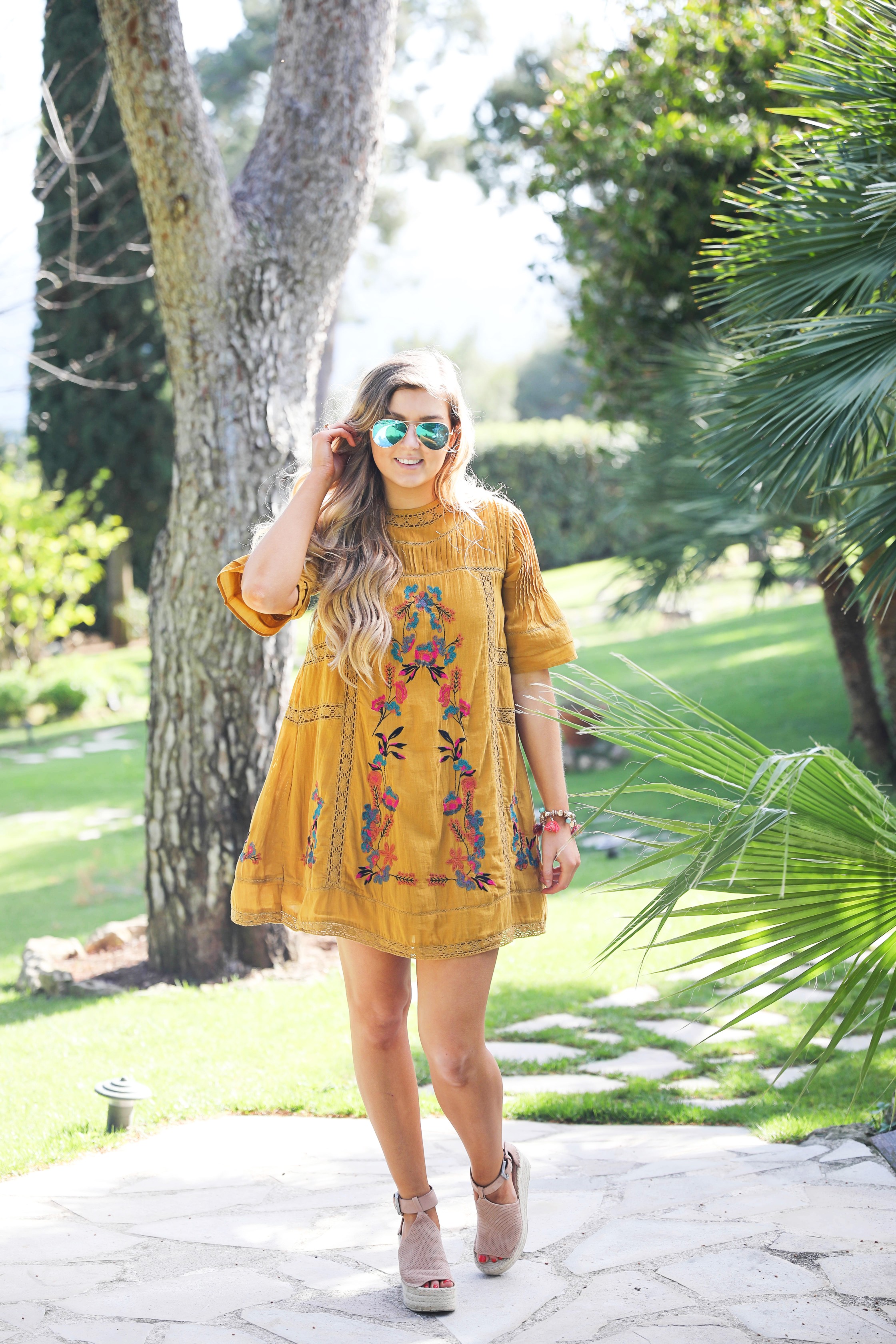 The cutest free people yellow dress! Perfect tropical dress and look so good with my blue mirrored sunglasses! I paired them with my rose Marc Fisher sandals. Full details on the blog dailydoseofcharm.com by lauren Lindmark daily dose of charm