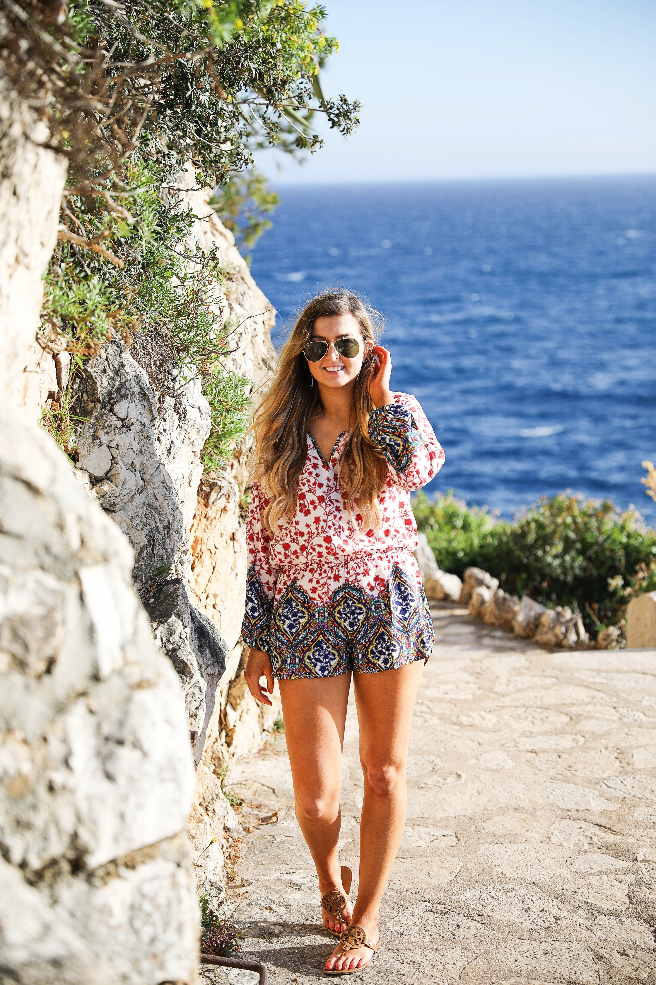 Romper by the ocean in Nice, France. The perfect outfit for a beach day! By Lauren Lindmark on dailydoseofcharm.com daily dose of charm fashion blog