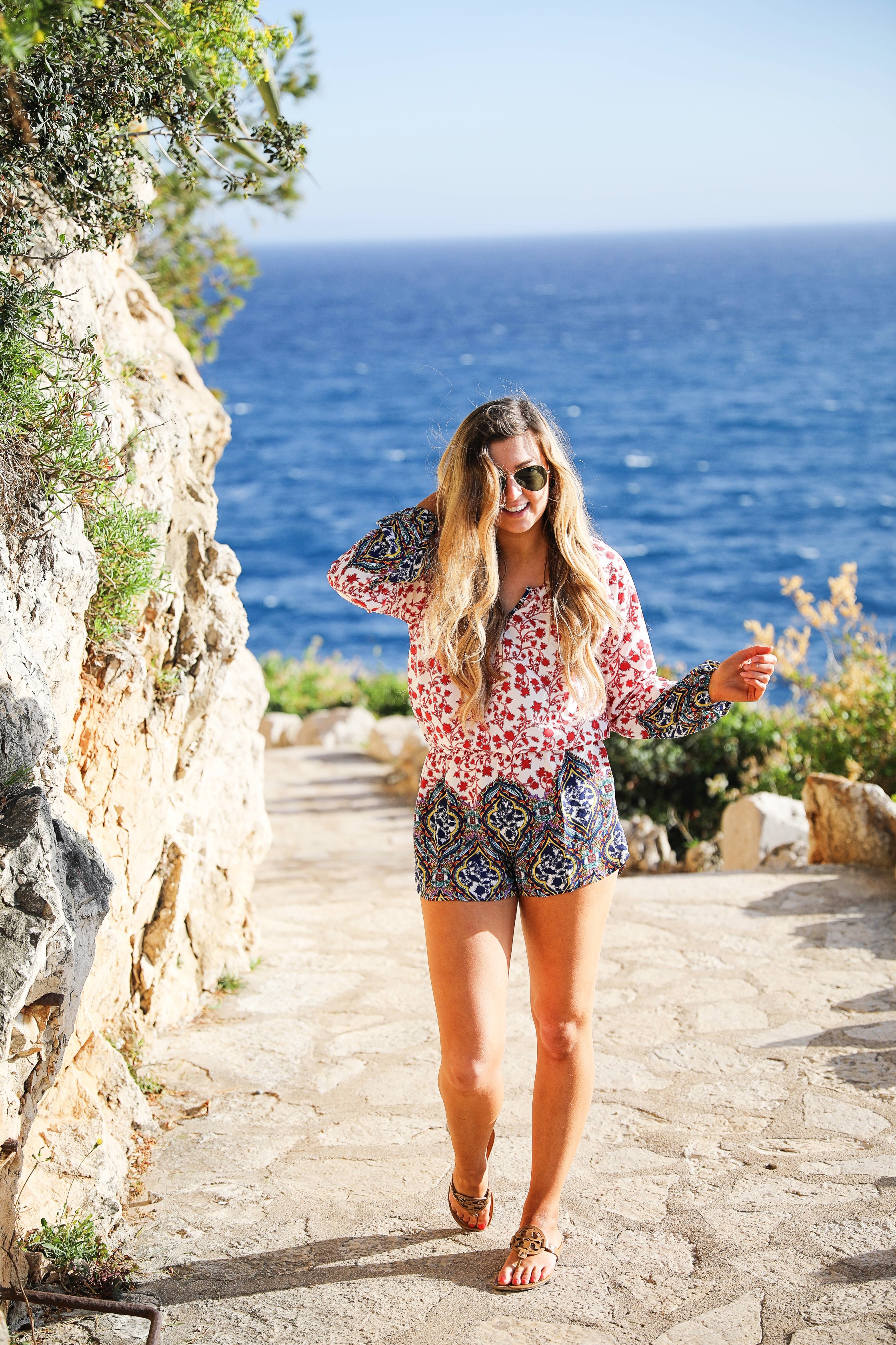 Romper by the ocean in Nice, France. The perfect outfit for a beach day! By Lauren Lindmark on dailydoseofcharm.com daily dose of charm fashion blog