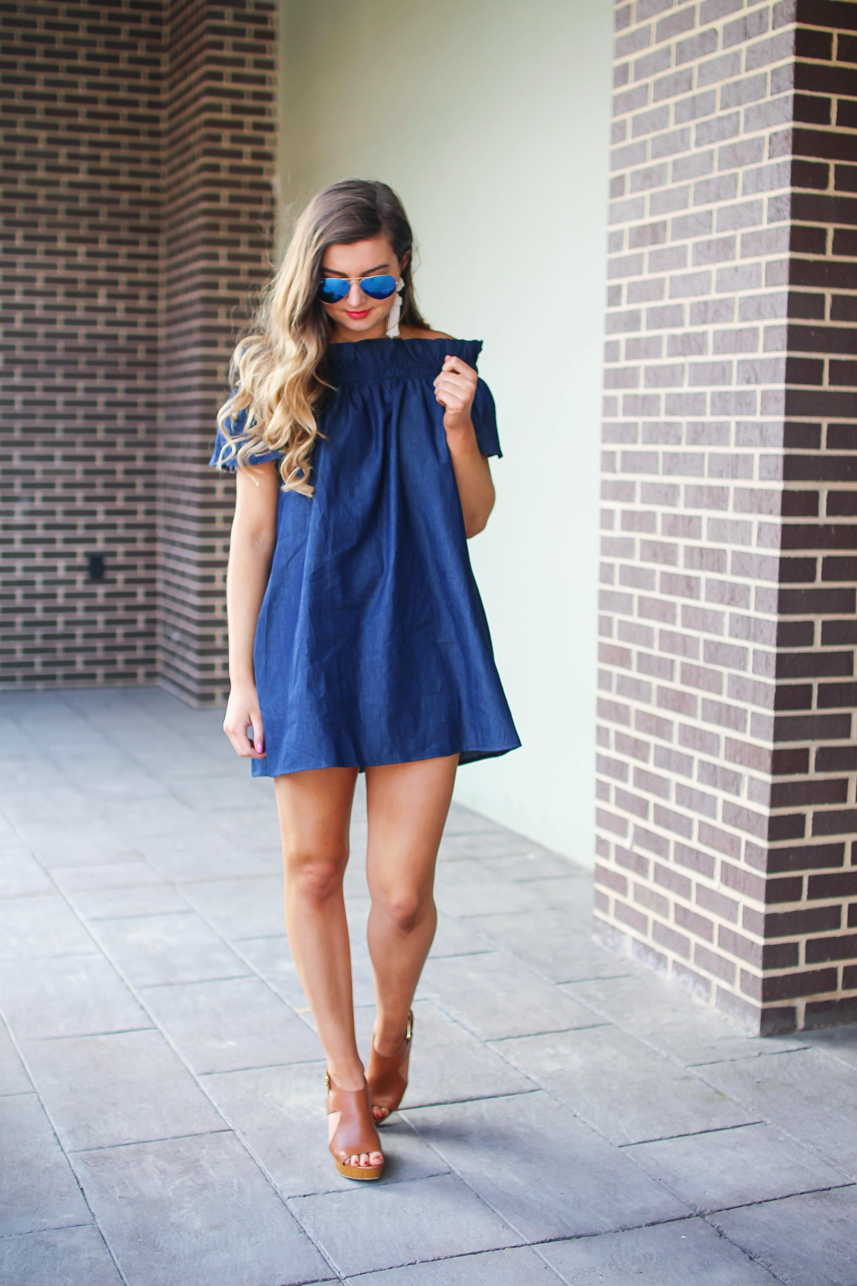 Denim off the shoulder dress! I love the denim trend for spring and this dress is a perfect addition to your closet! I paired it with brown wedges and Lisi Lerch tassel earrings. Also my blue ray ban aviators that are on sale! By Lauren Lindmark on dailydoseofcharm.com daily dose of charm