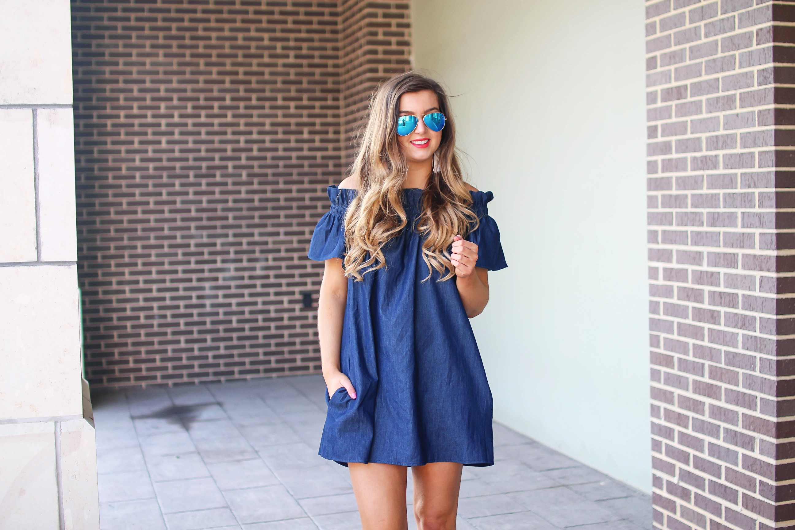 Denim off the shoulder dress! I love the denim trend for spring and this dress is a perfect addition to your closet! I paired it with brown wedges and Lisi Lerch tassel earrings. Also my blue ray ban aviators that are on sale! By Lauren Lindmark on dailydoseofcharm.com daily dose of charm