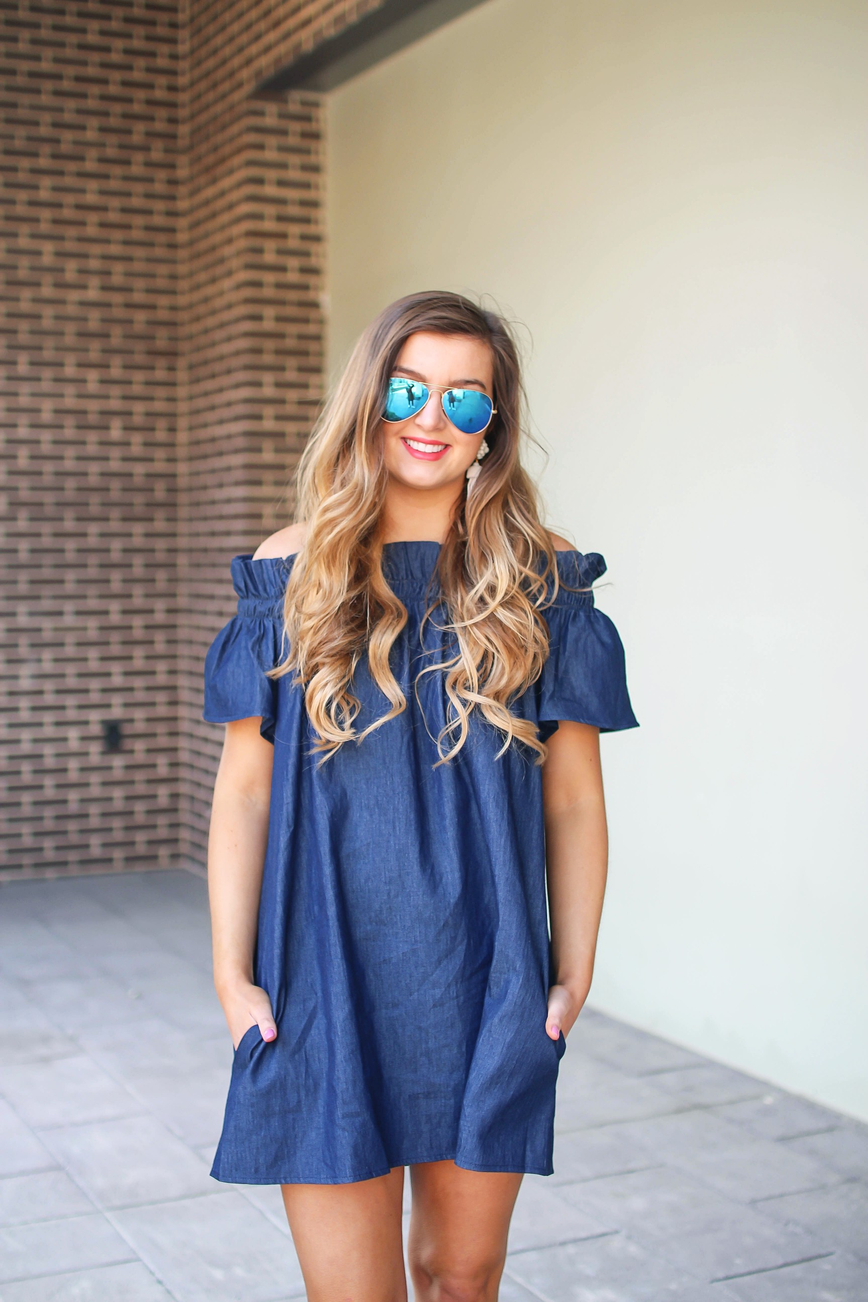 Denim off the shoulder dress! I love the denim trend for spring and this dress is a perfect addition to your closet! I paired it with brown wedges and Lisi Lerch tassel earrings. Also my blue ray ban aviators that are on sale! By Lauren Lindmark on dailydoseofcharm.com daily dose of charm