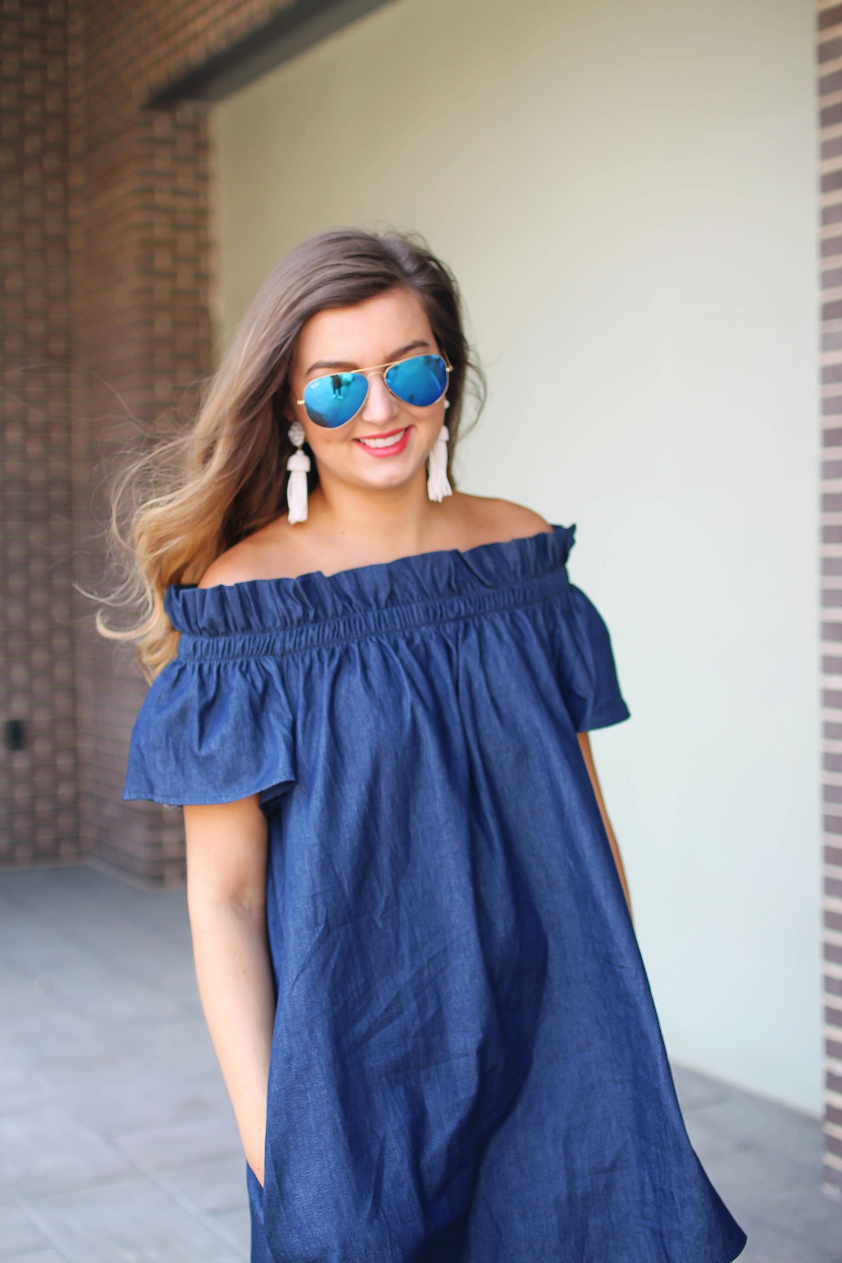 Denim off the shoulder dress! I love the denim trend for spring and this dress is a perfect addition to your closet! I paired it with brown wedges and Lisi Lerch tassel earrings. Also my blue ray ban aviators that are on sale! By Lauren Lindmark on dailydoseofcharm.com daily dose of charm