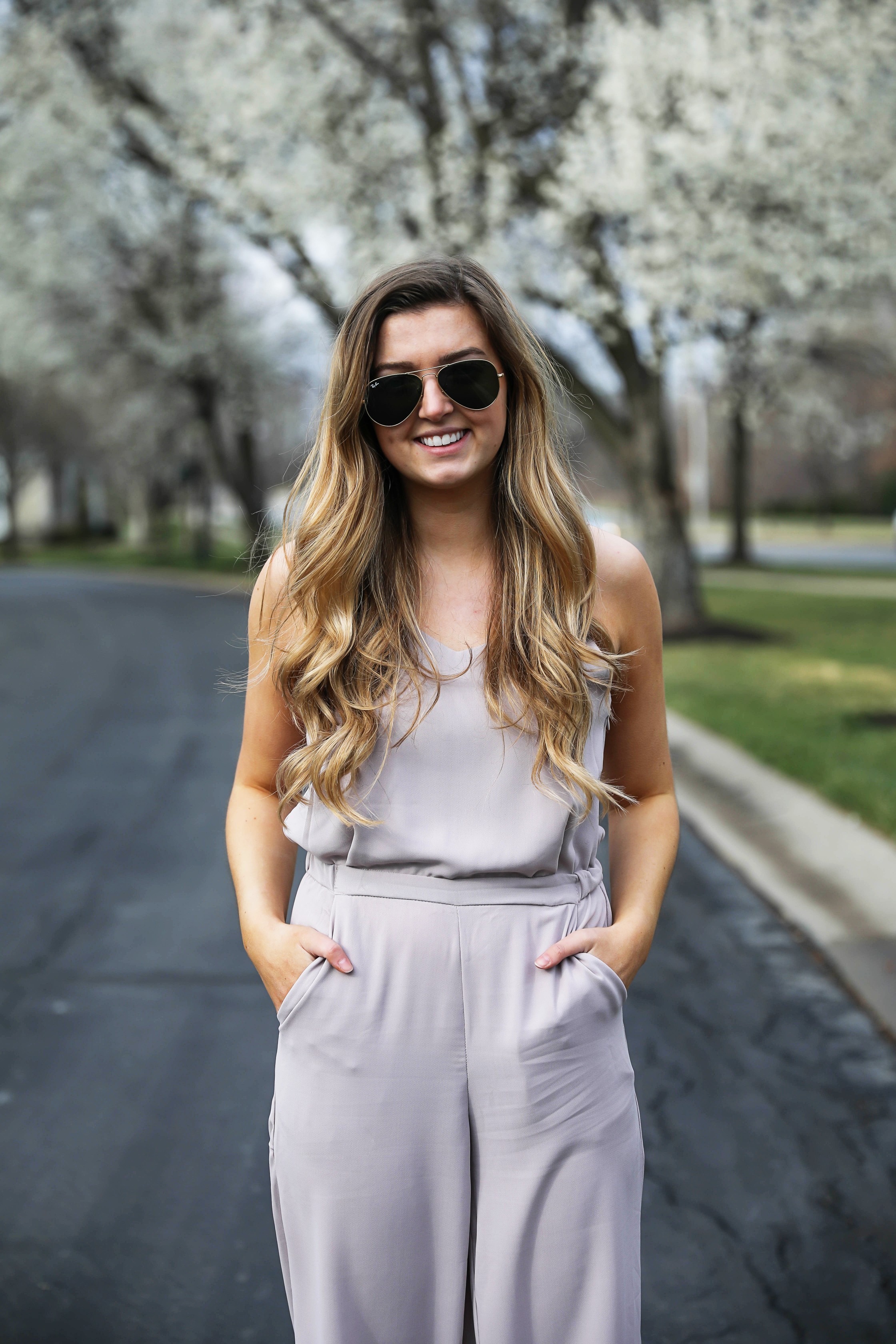 Light Pink Flowy Jumpsuit! Paired with the cutest tied flats and ray ban aviators! By Lauren Lindmark on Daily Dose of Charm dailydoseofcharm.com